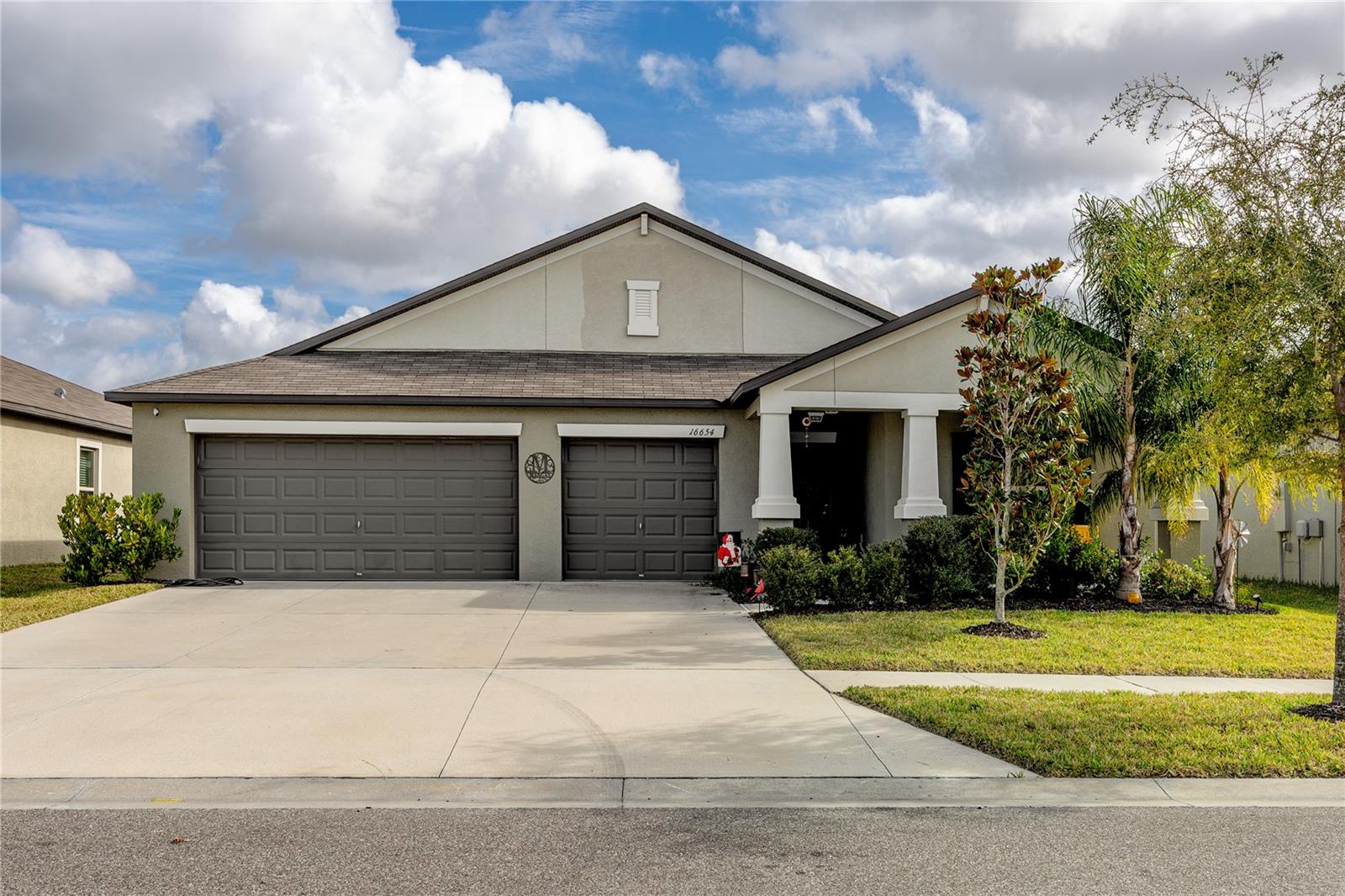 Three car garage, single level, non-flood zone home in a quiet, newly built community in Wimauma, SE of Tampa.
