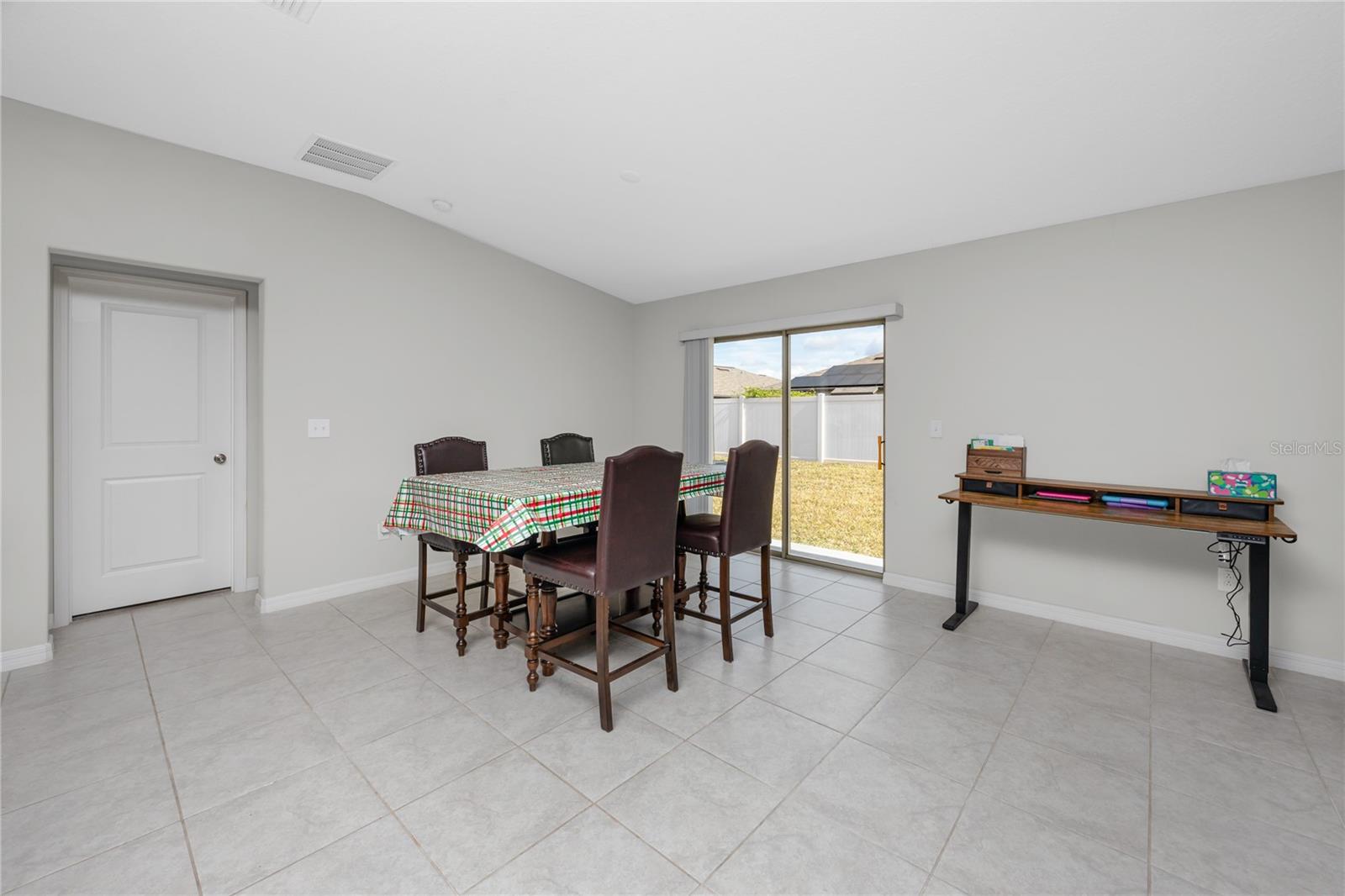 Dining space. Doorway leads to the primary ensuite.