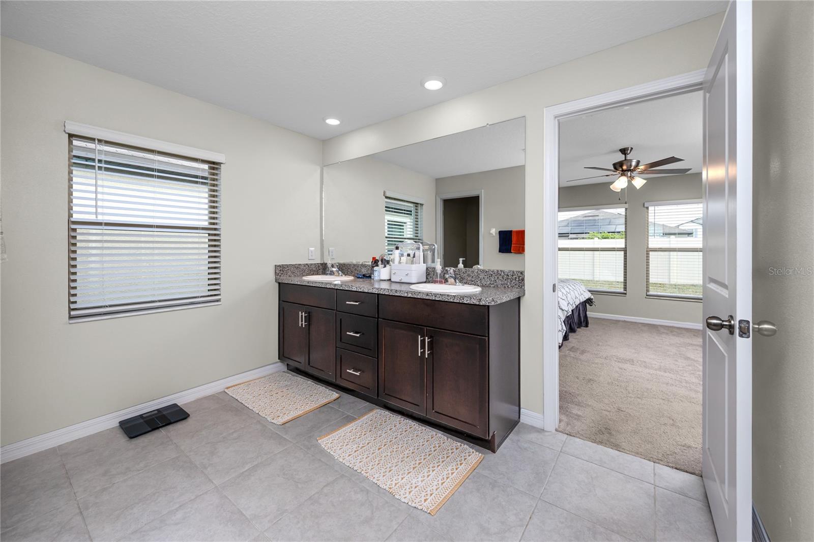 Dual vanity in the primary en-suite with easy care tile.