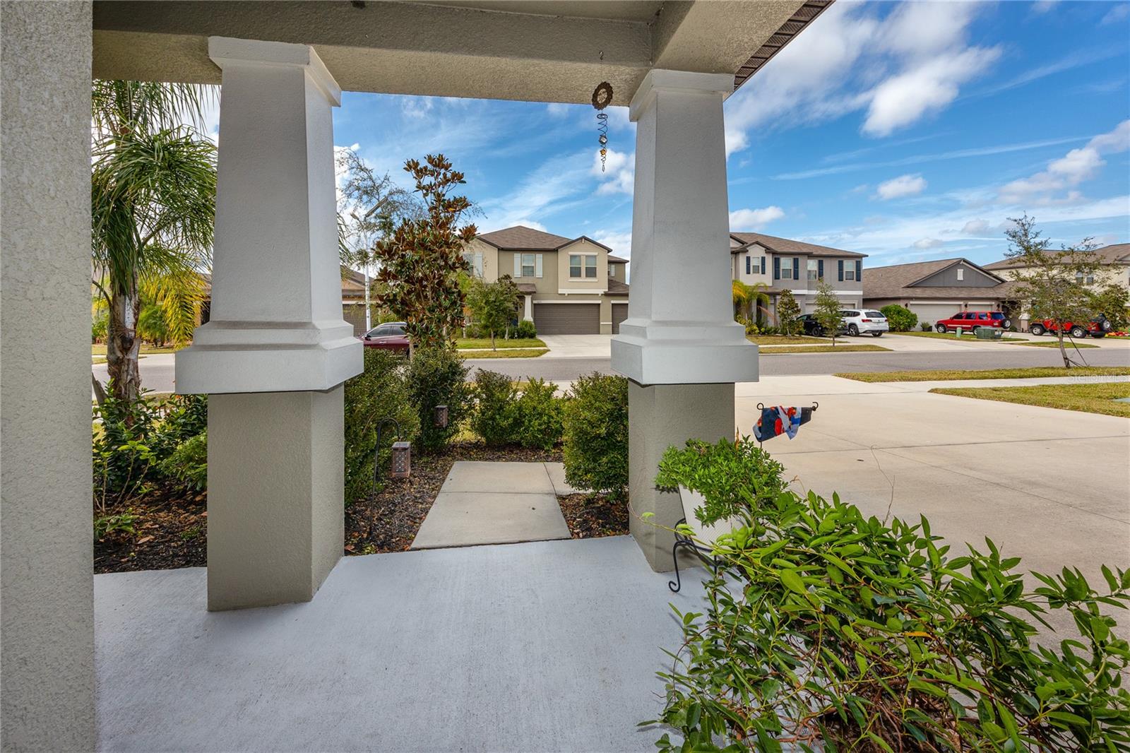 Covered front porch looks over this quiet community.