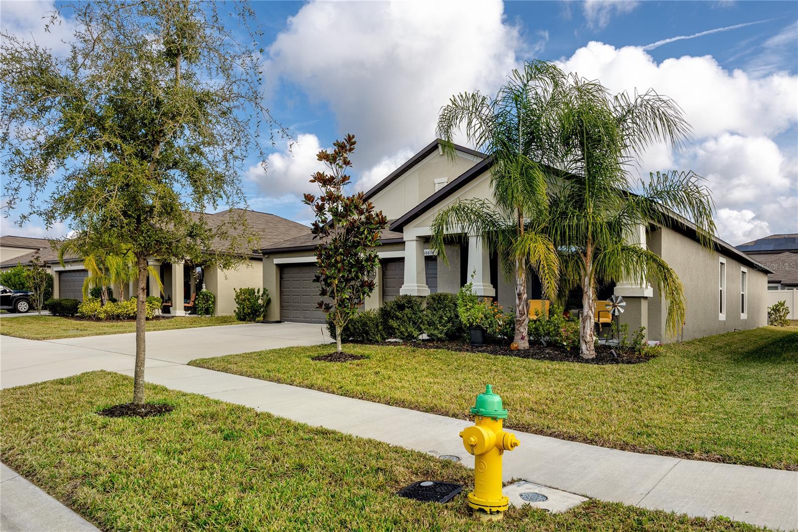 Mature landscaping, extra wide streets for privacy, and close fire hydrant for safety.