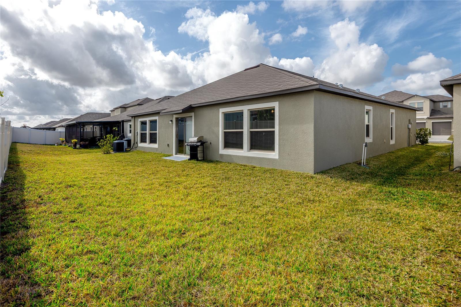 Semi-fenced in back yard with space to roam and make your own.