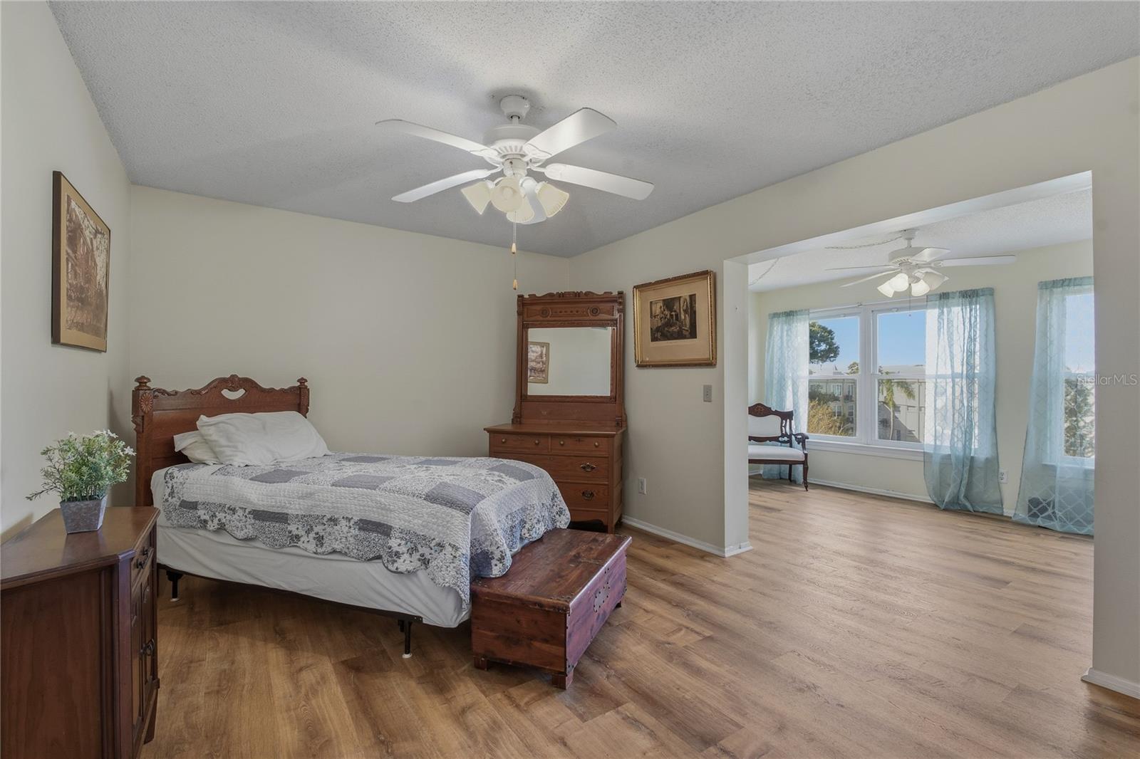 PRIMARY BEDROOM AND BONUS ROOM