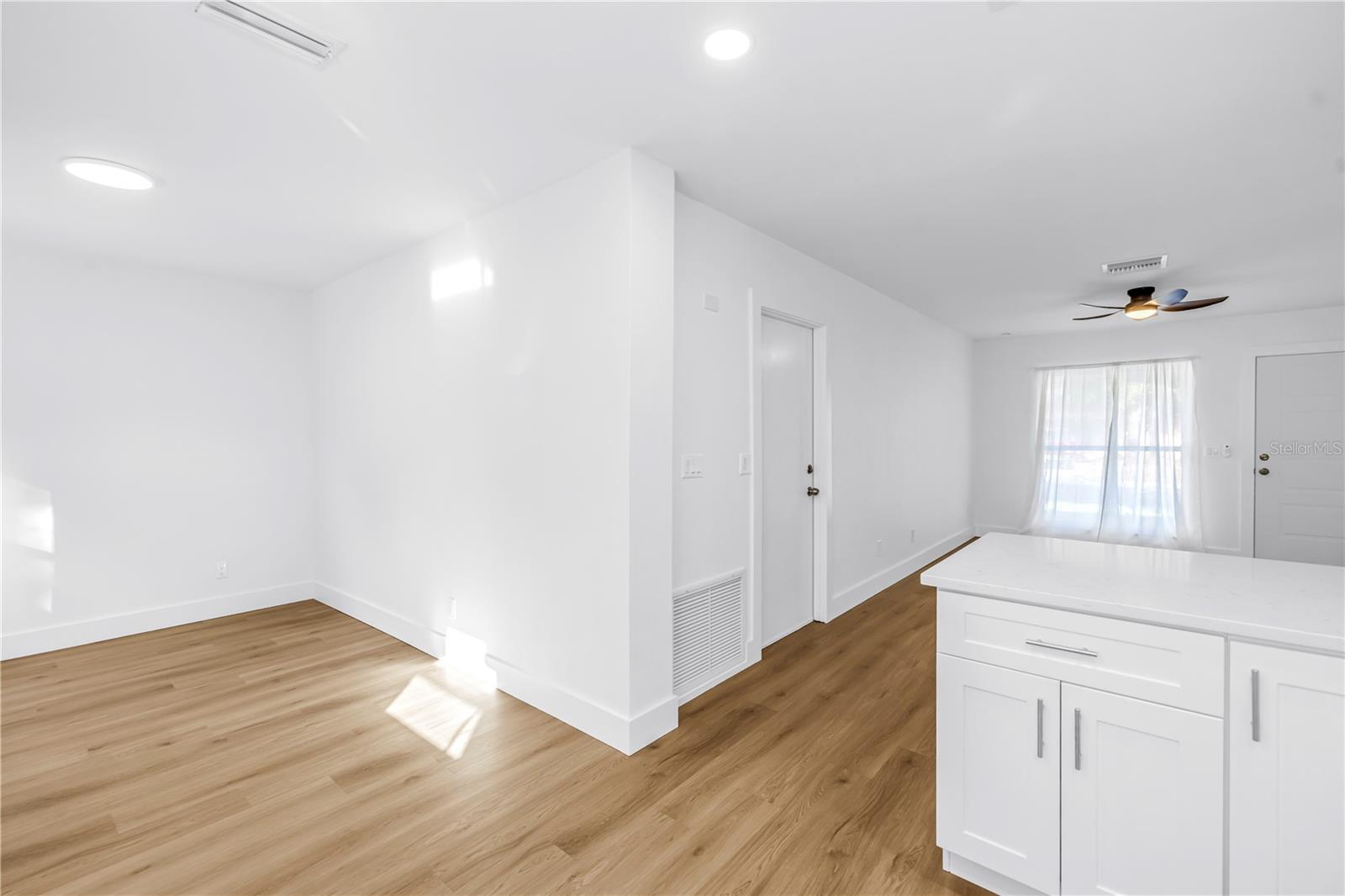 view from kitchen into kitchen dining space