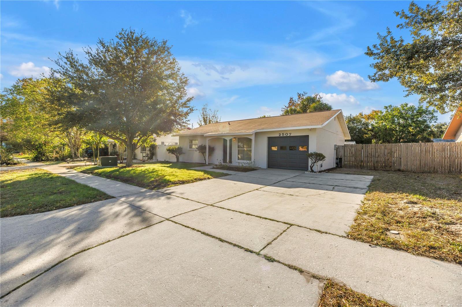 side view of front of home and oversized driveway