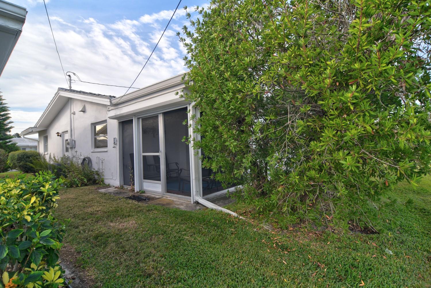 Nicely Landscaped Back of Property with Lanai