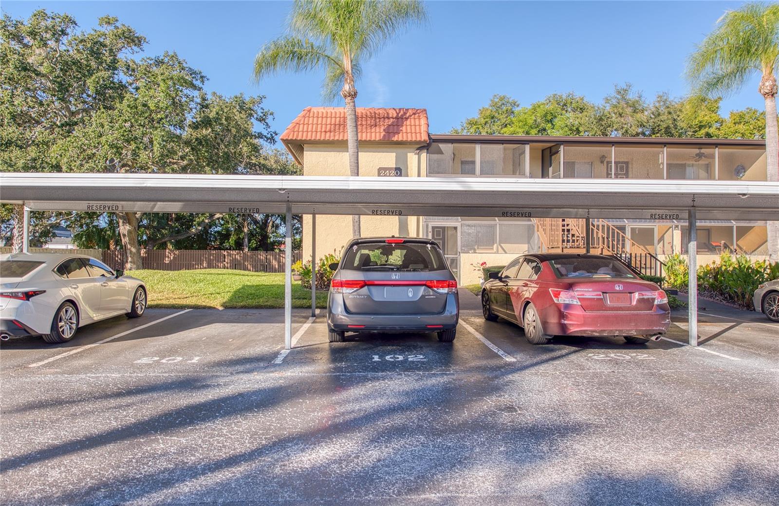 Carport Parking Space 201 is located directly in front of condo.