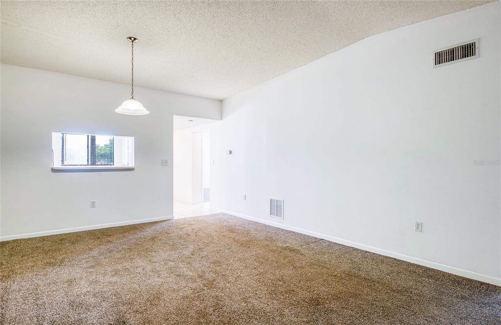 Dining Area is adjacent to the Kitchen and Living Room.