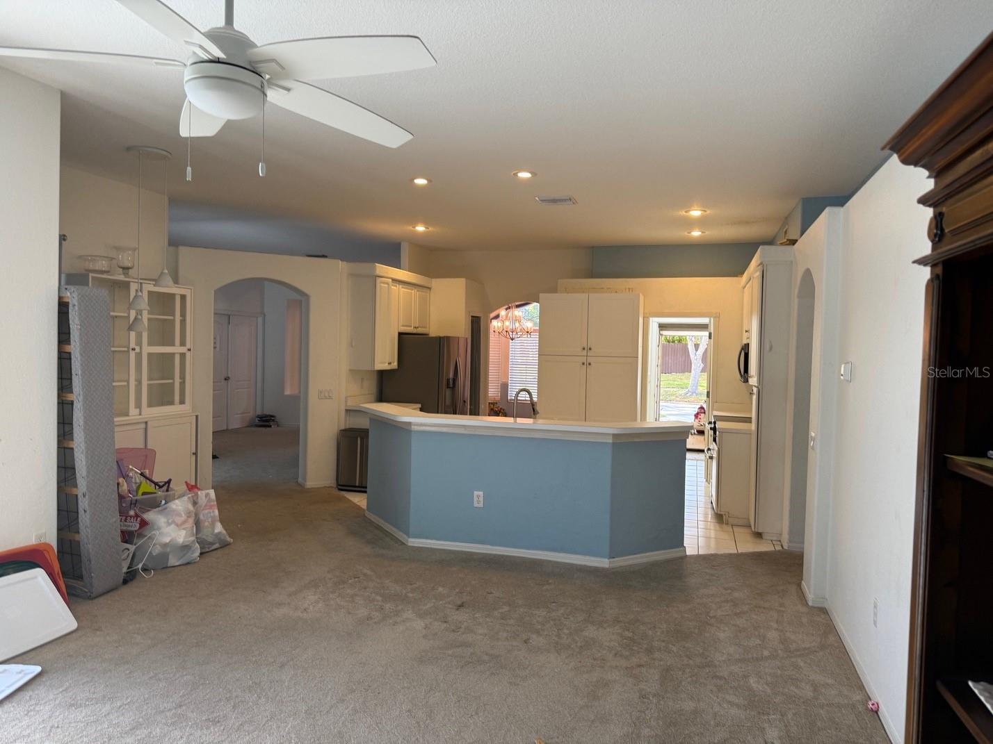 view of open kitchen  island sink area from living room