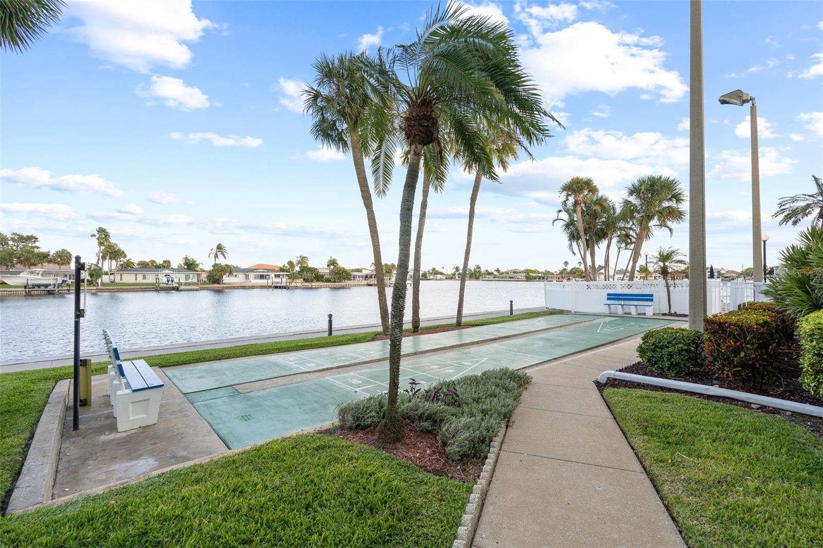 Enjoy playful game of shuffle board.