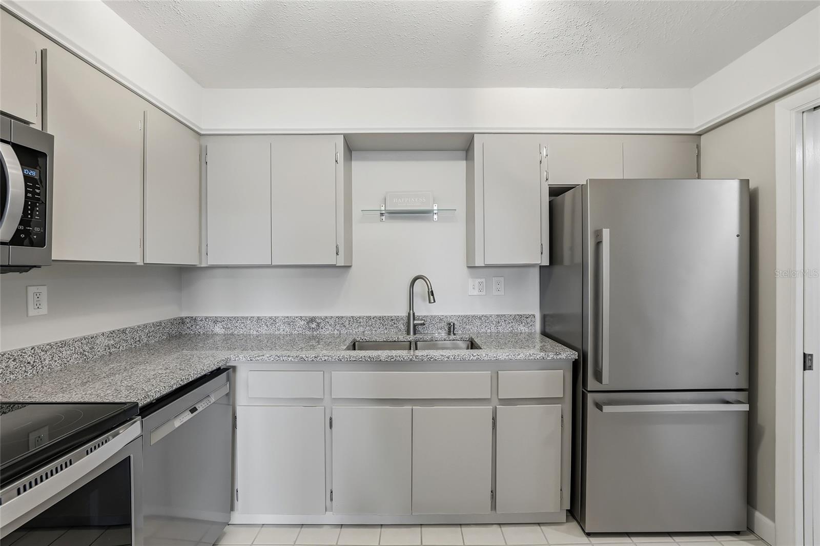 Granite counter tops and refurbished cabinets.
