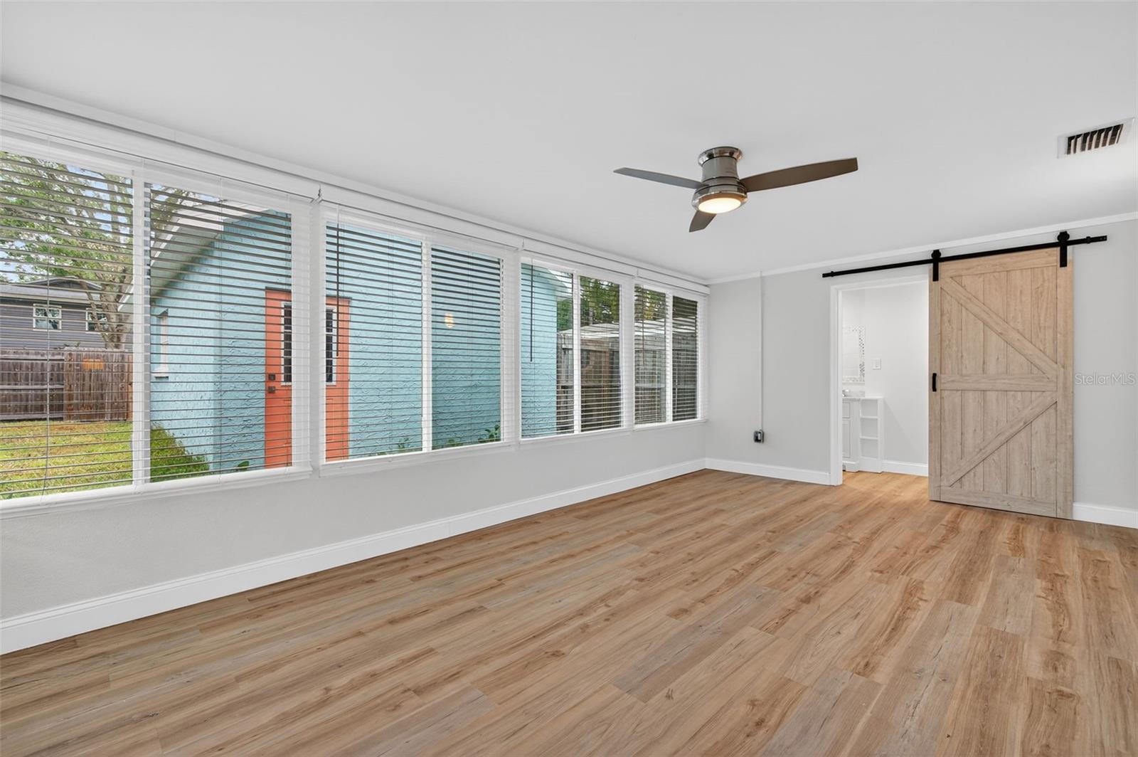 Enclosed Sunroom w/Half Bath and Laundry