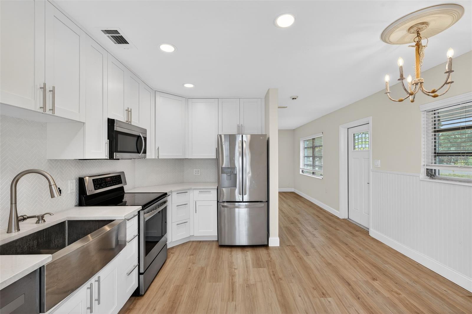 Brand new kitchen with stainless steel appliances & farmhouse sink