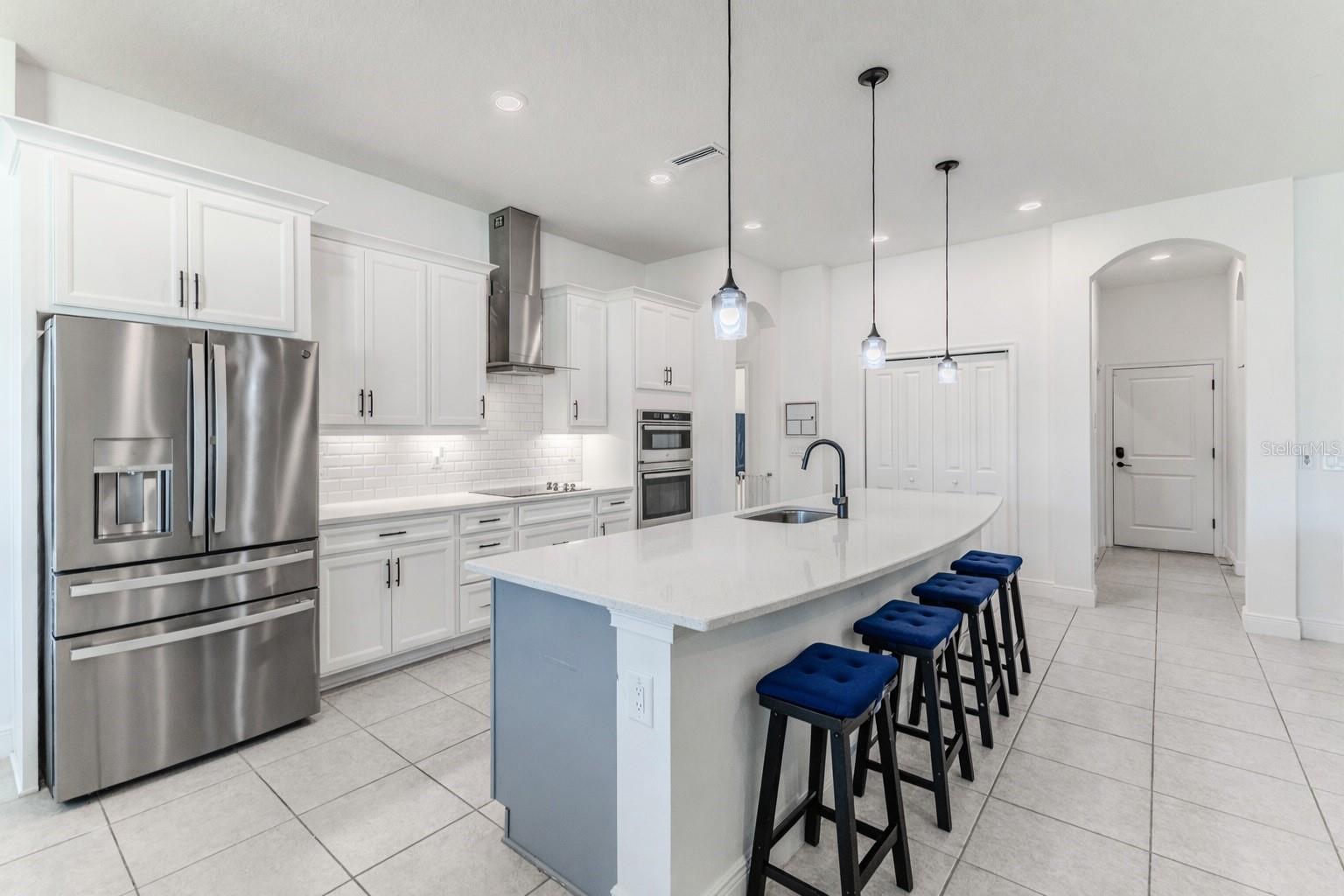 Stainless Steel Double Drawer French Refrigerator, Chimney Vent, Dishwasher, Double Convection Oven (one can be used as a microwave), Cook Top