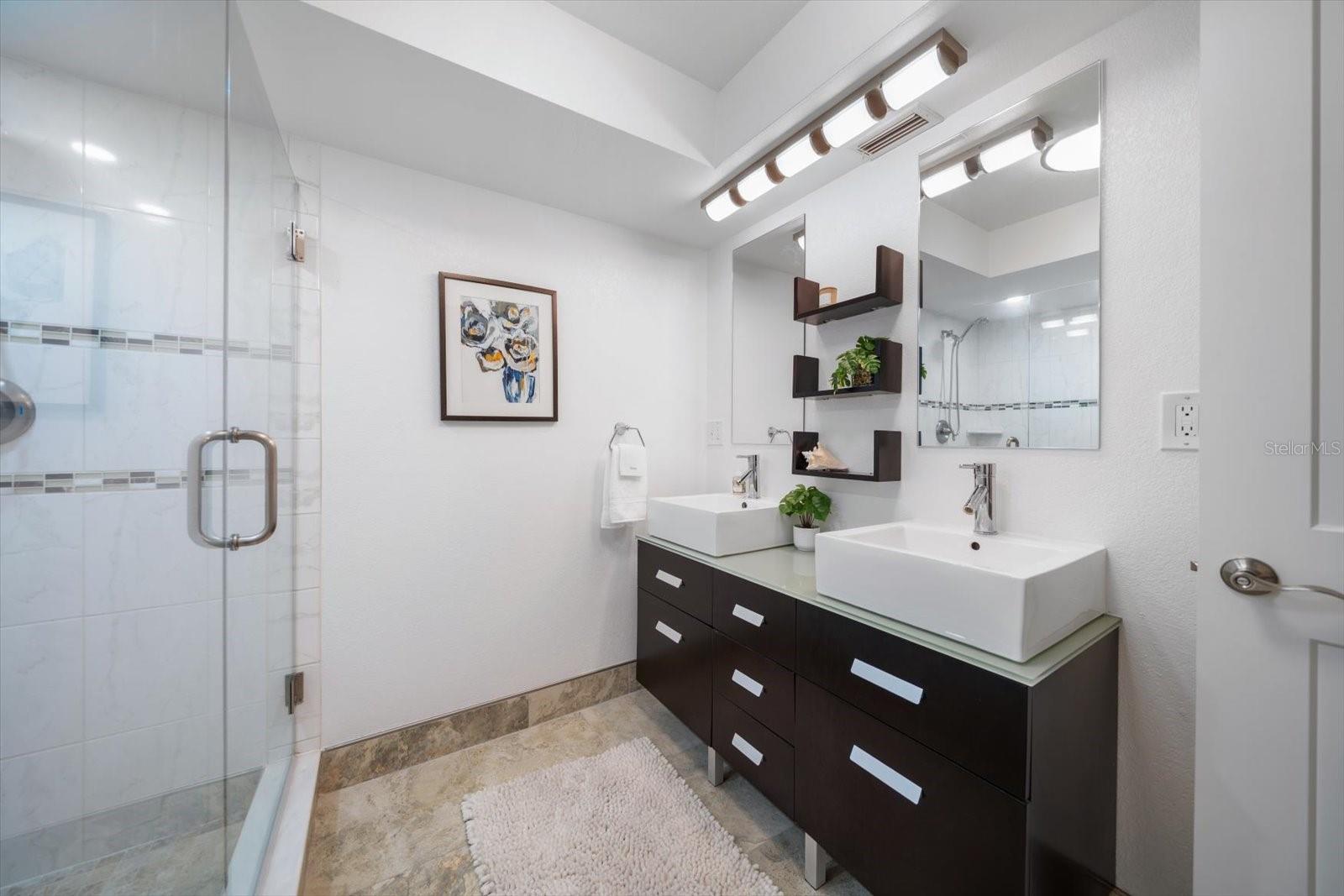 Contemporary double vanities in primary bath area.