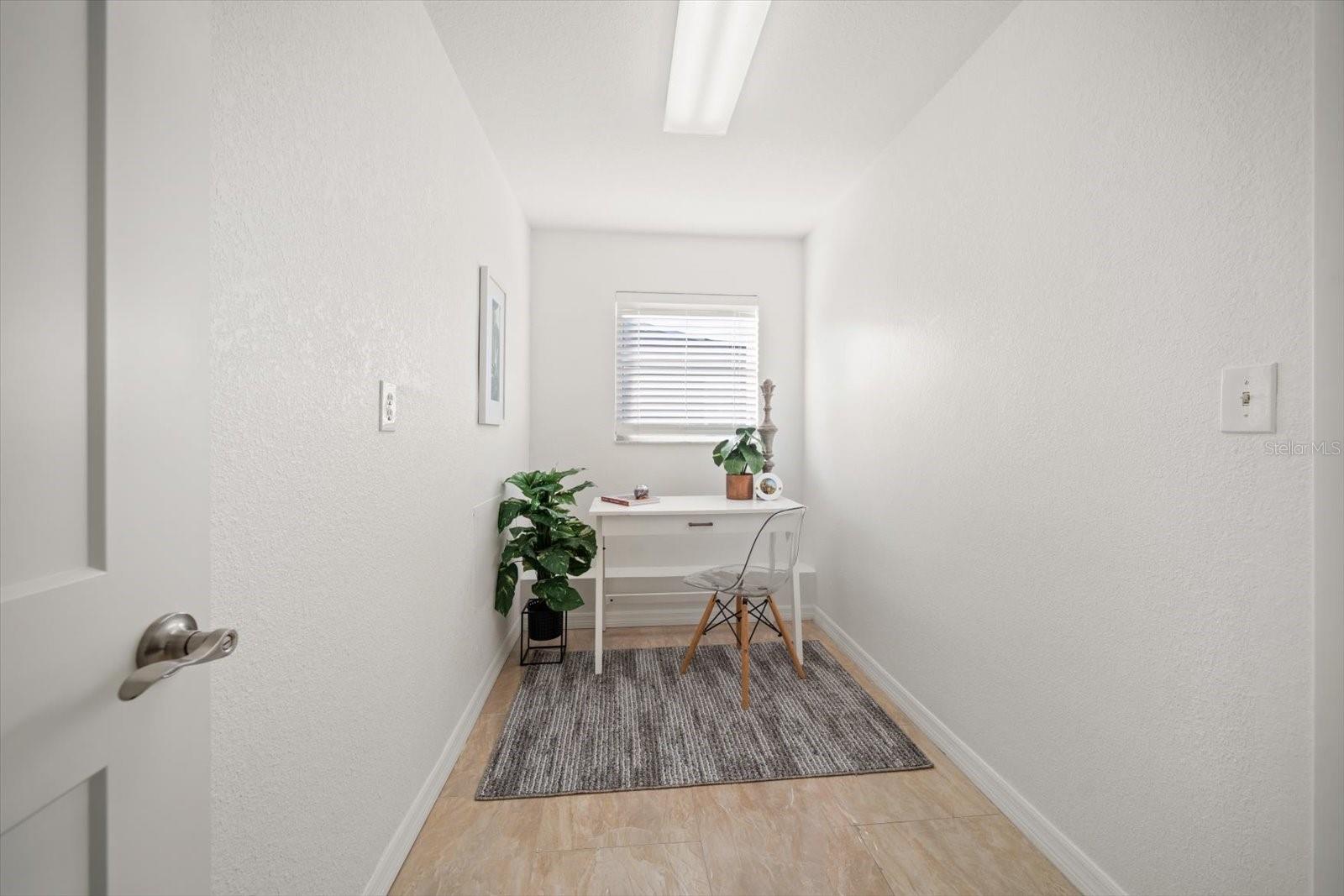 Multi purpose room- perfect for den, office or additional storage off of kitchen area.