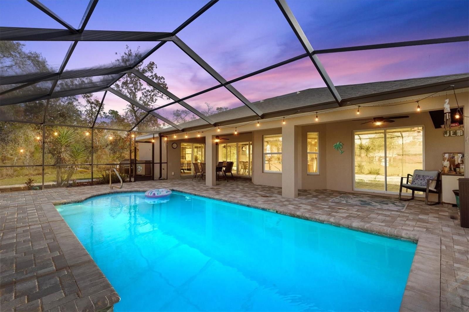 Screened Pool Adorned by Pavers