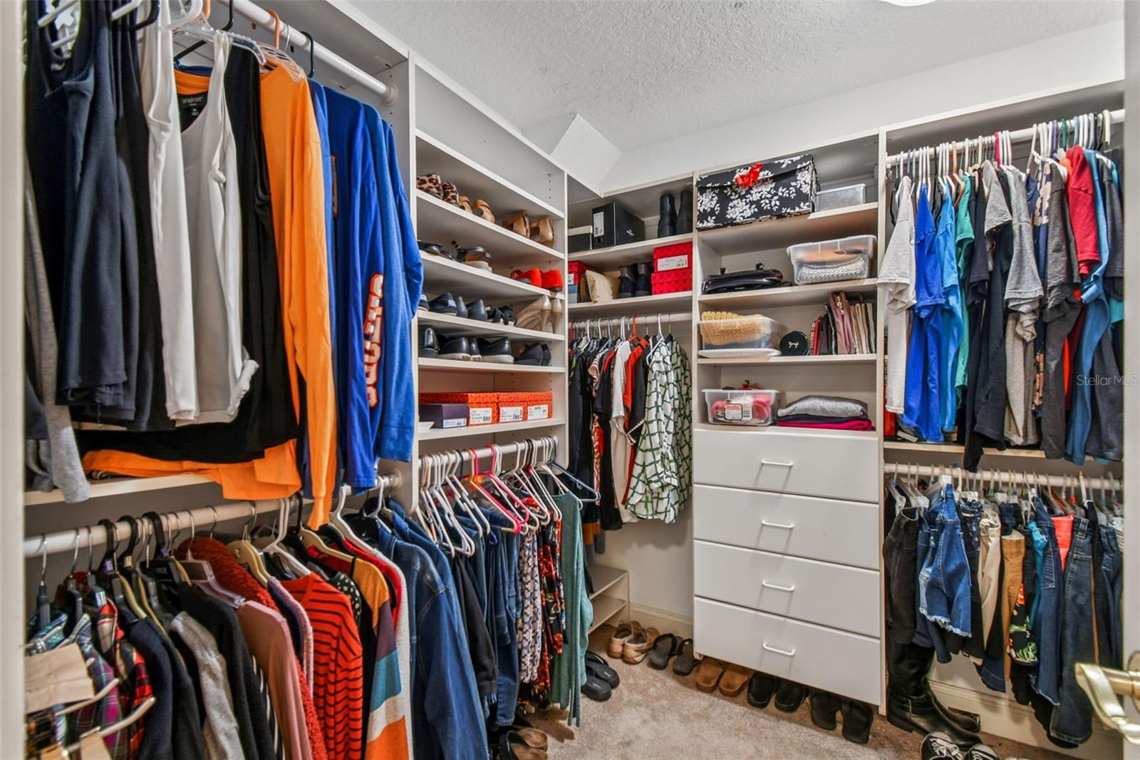 Walk in closet for primary with built ins