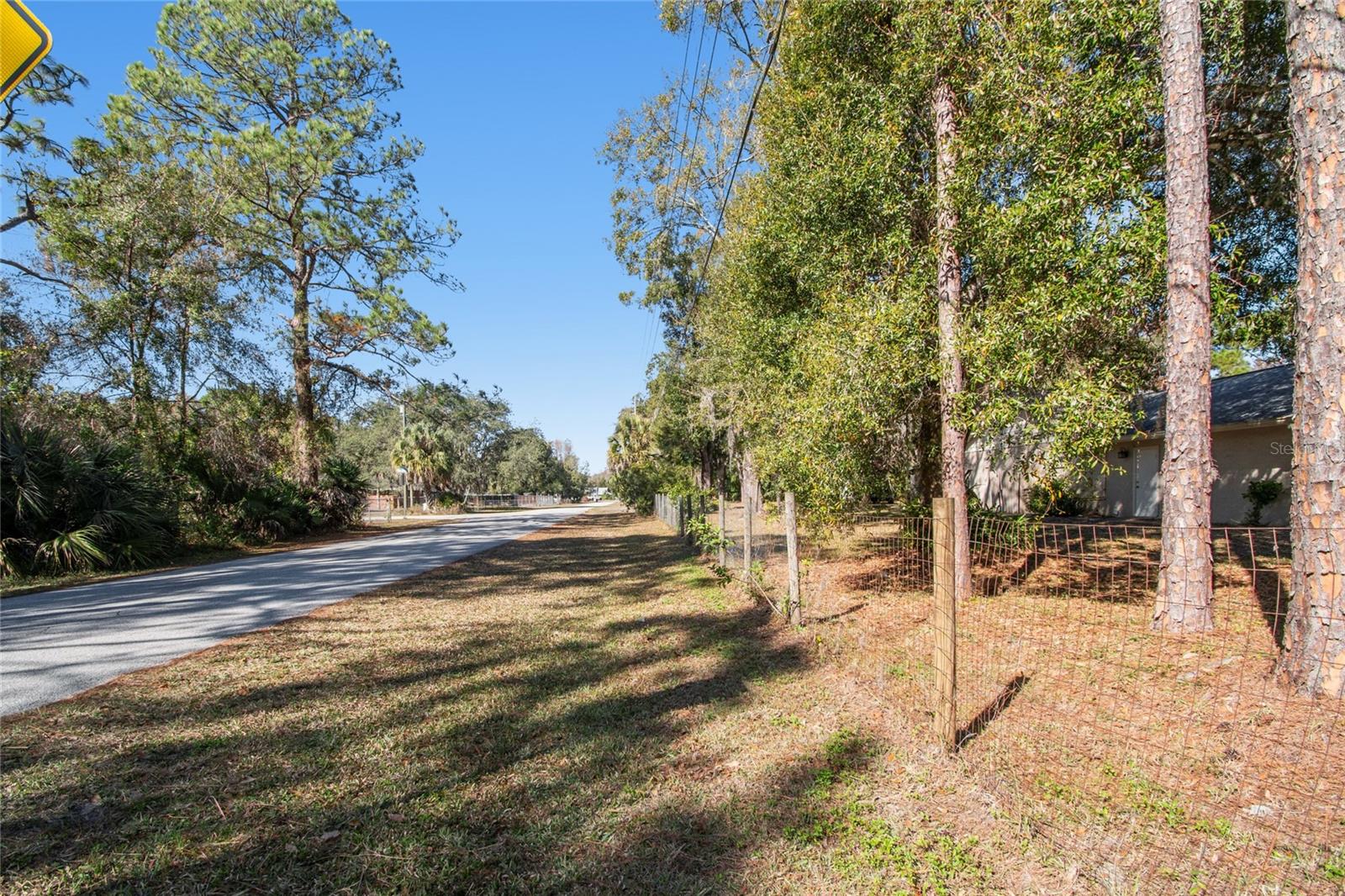 Side street-Gunlock Road showing left fence line of property.