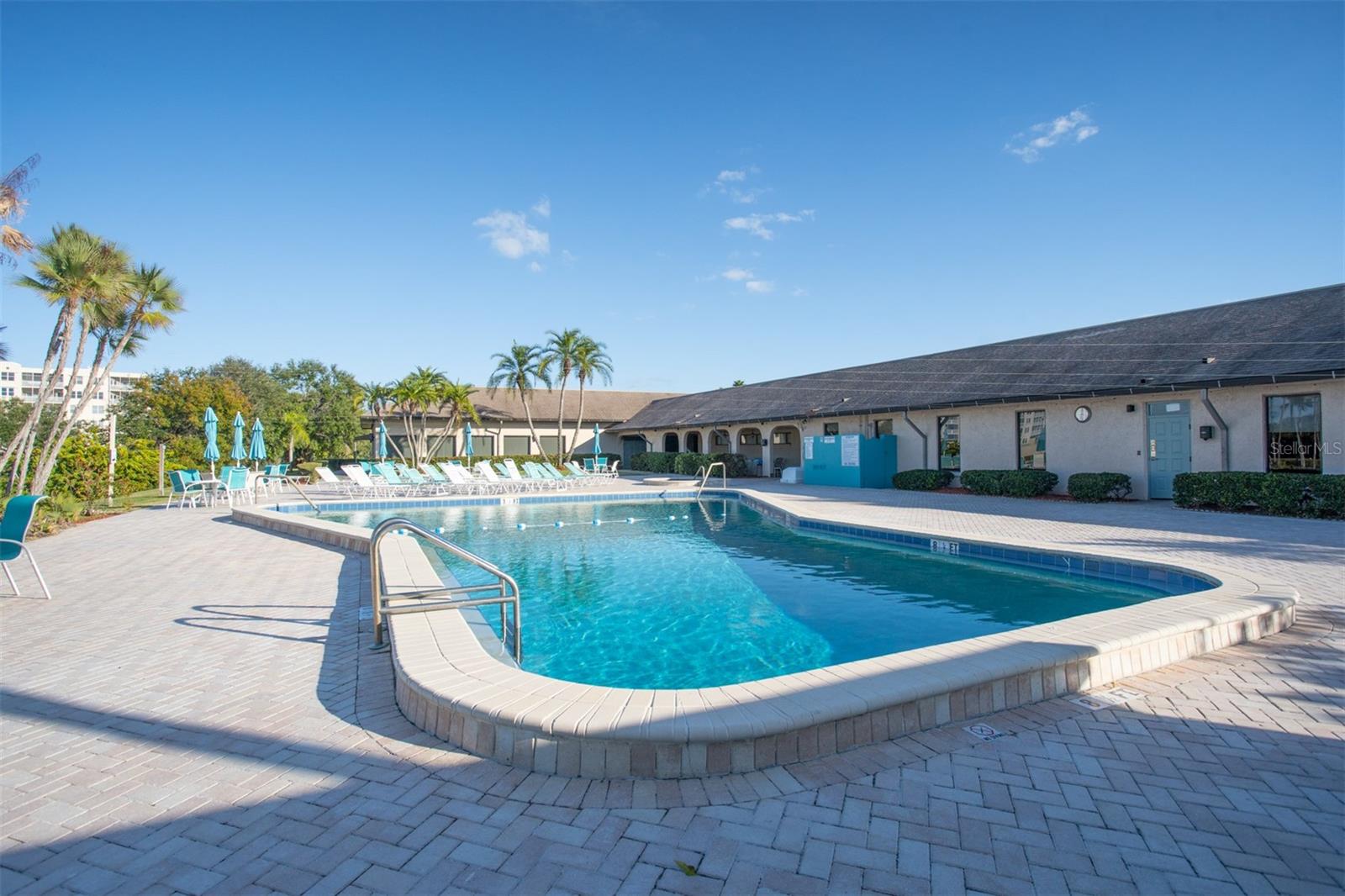 Pool Area with Umbrella Tables