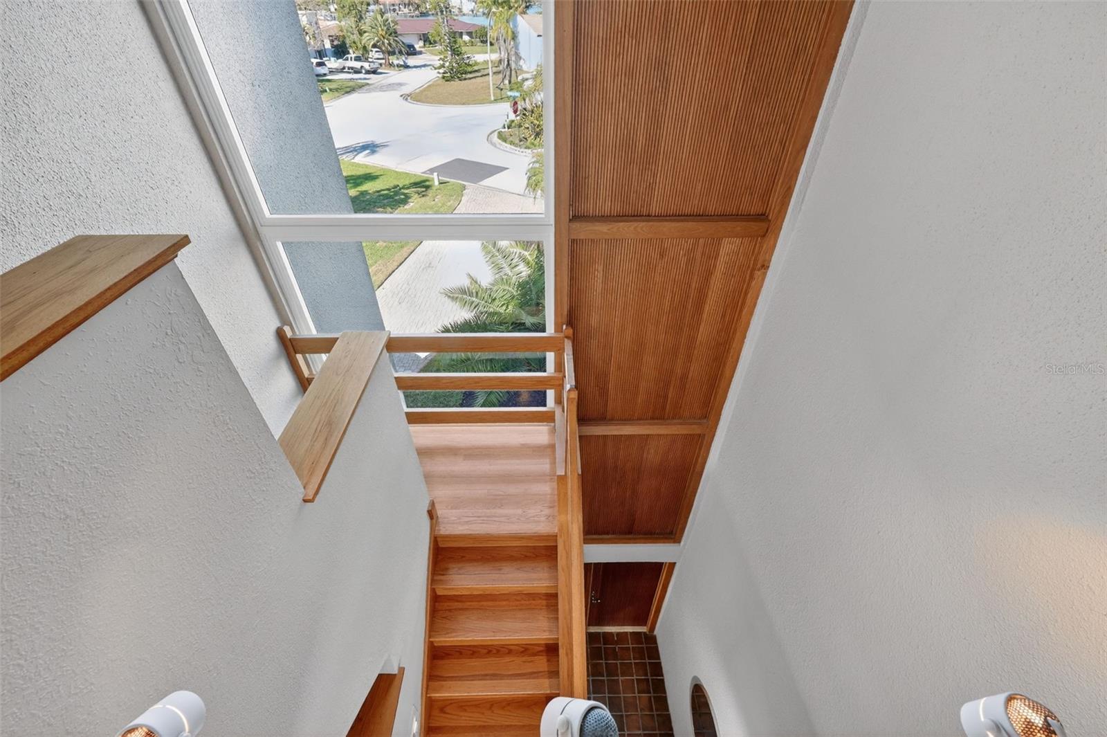 Sunlit Stairs with Fluted Wood Details