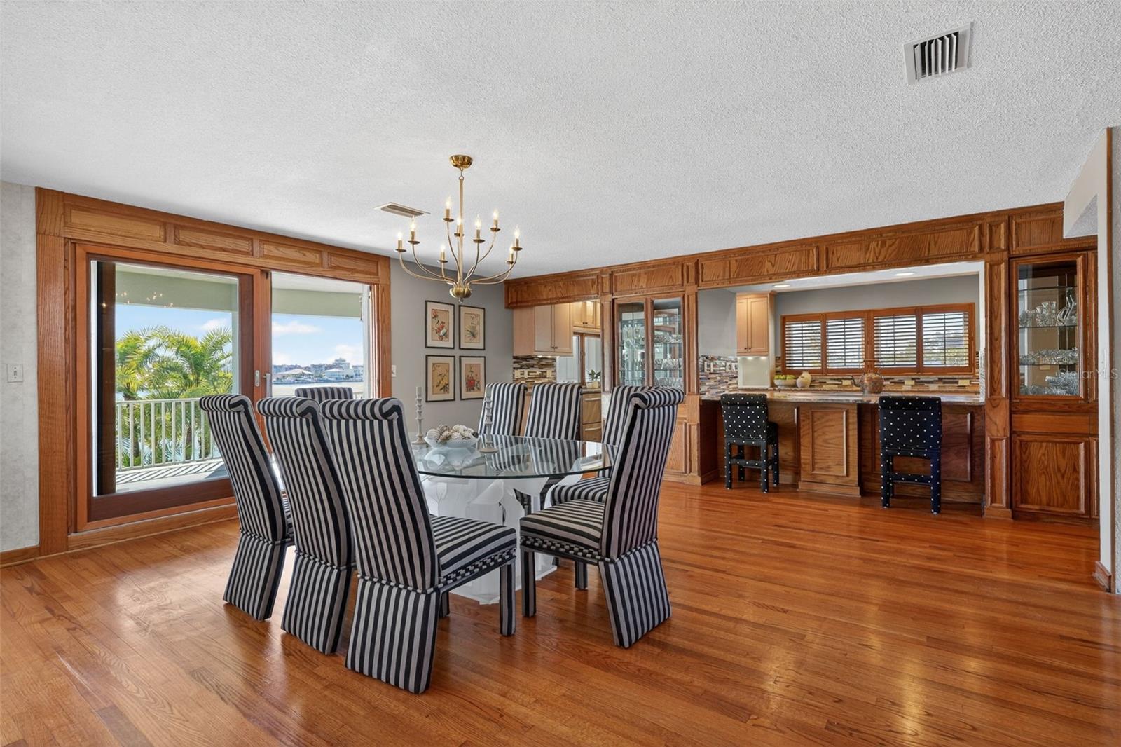 Dining Area with Hurricane Impact Sliders and Views to Boca Ciega Bay