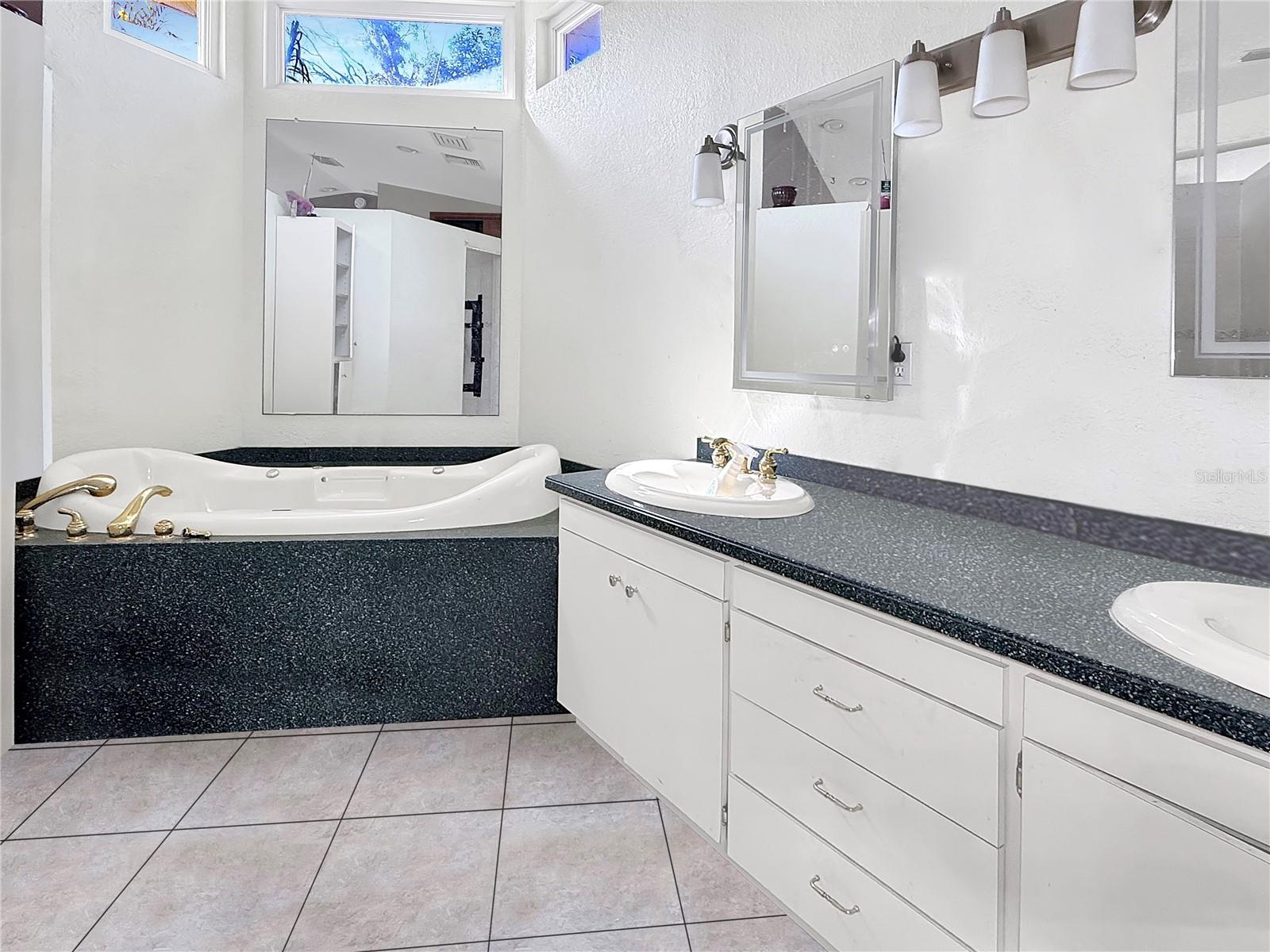 Natural light floods in to this ensuite primary bathroom!