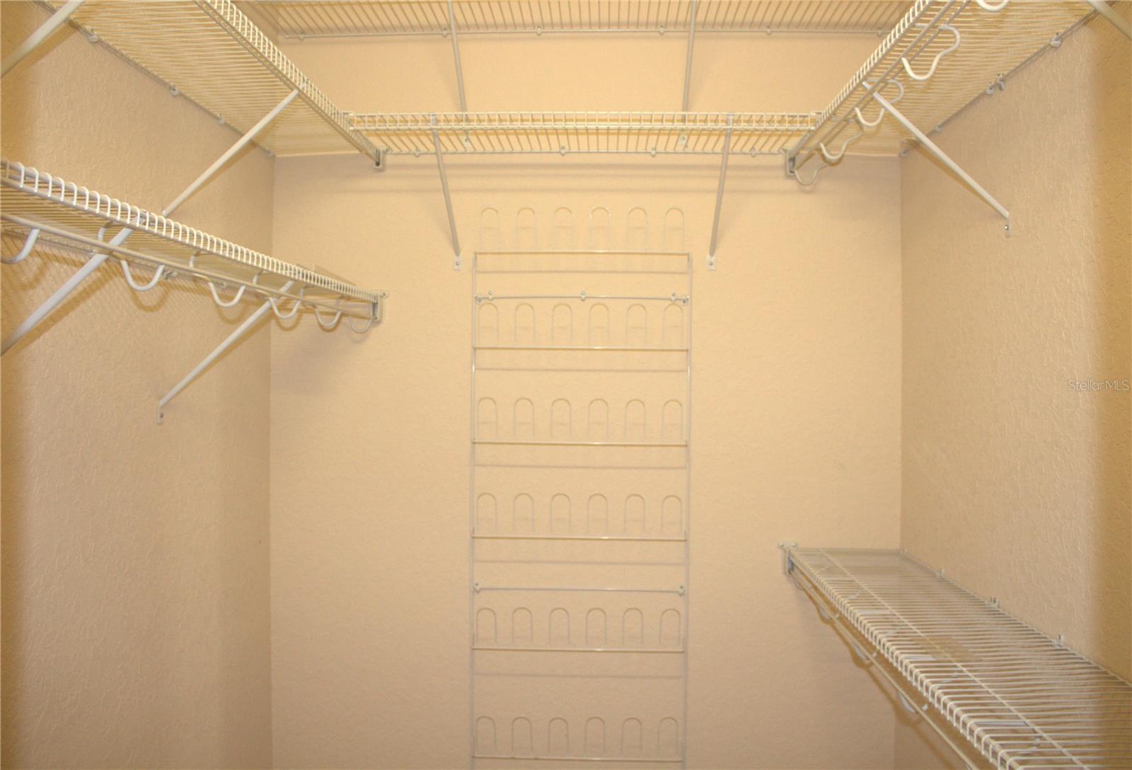 Primary bedroom. One of two walk in closets