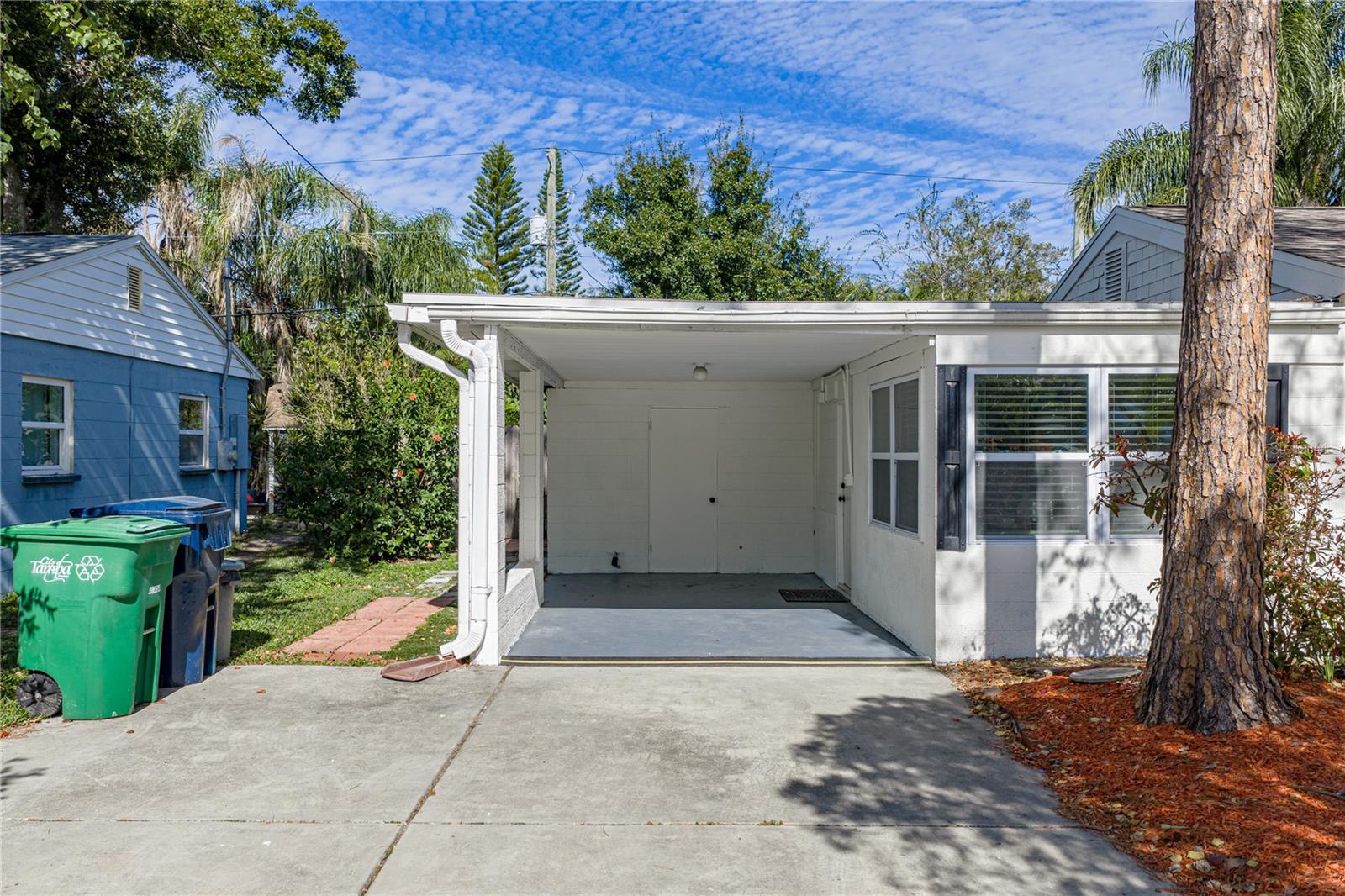 1 Car Carport with oversized 2 Car Driveway.
