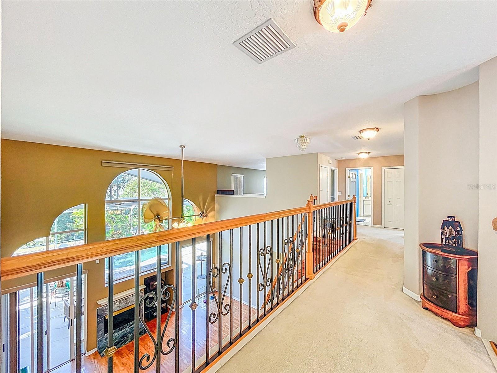 Landing between primary en suite and bedrooms 2, 3 and loft