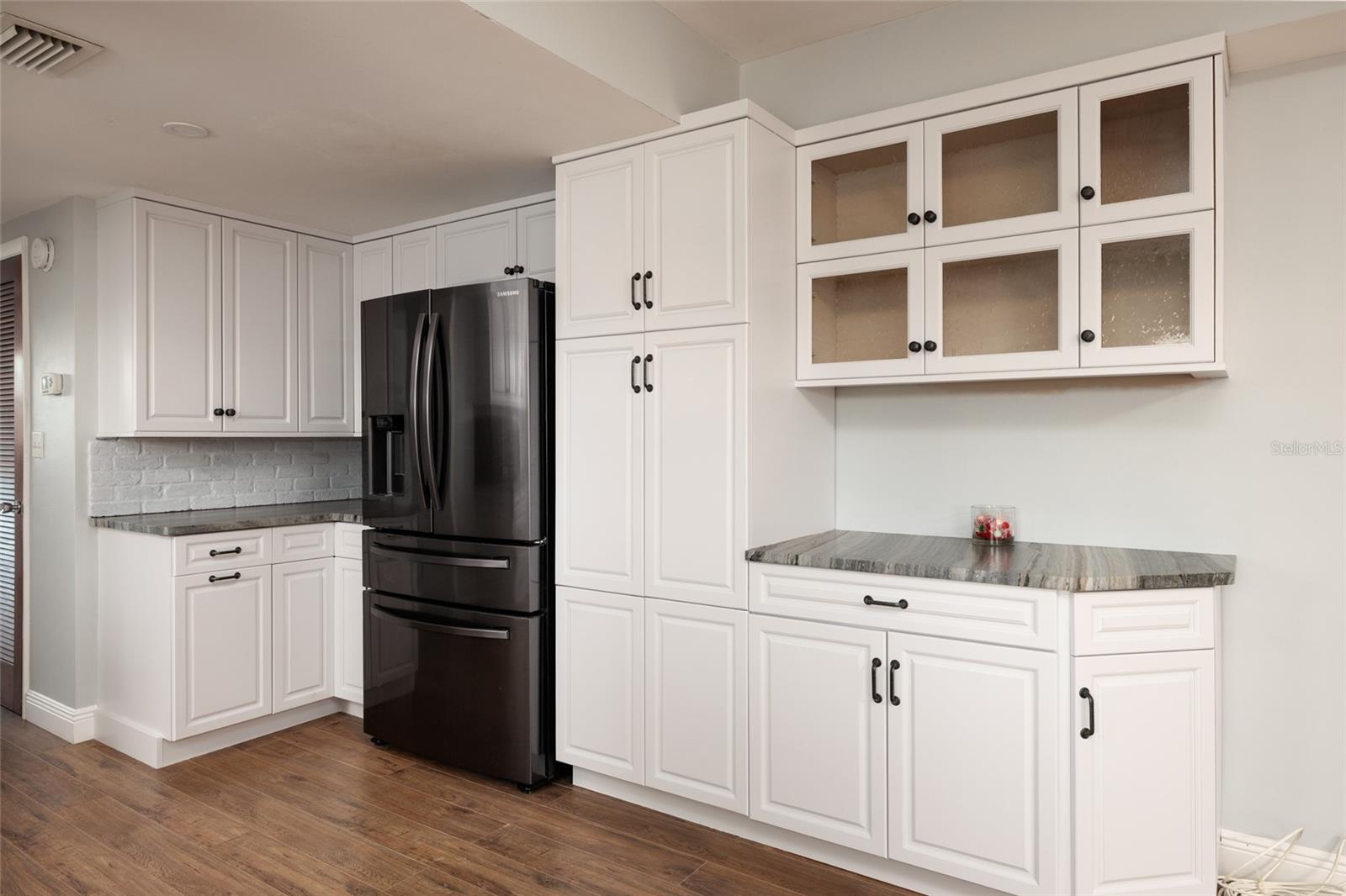 Kitchen w/extra cabinets & pantry w/Pull out shelves.