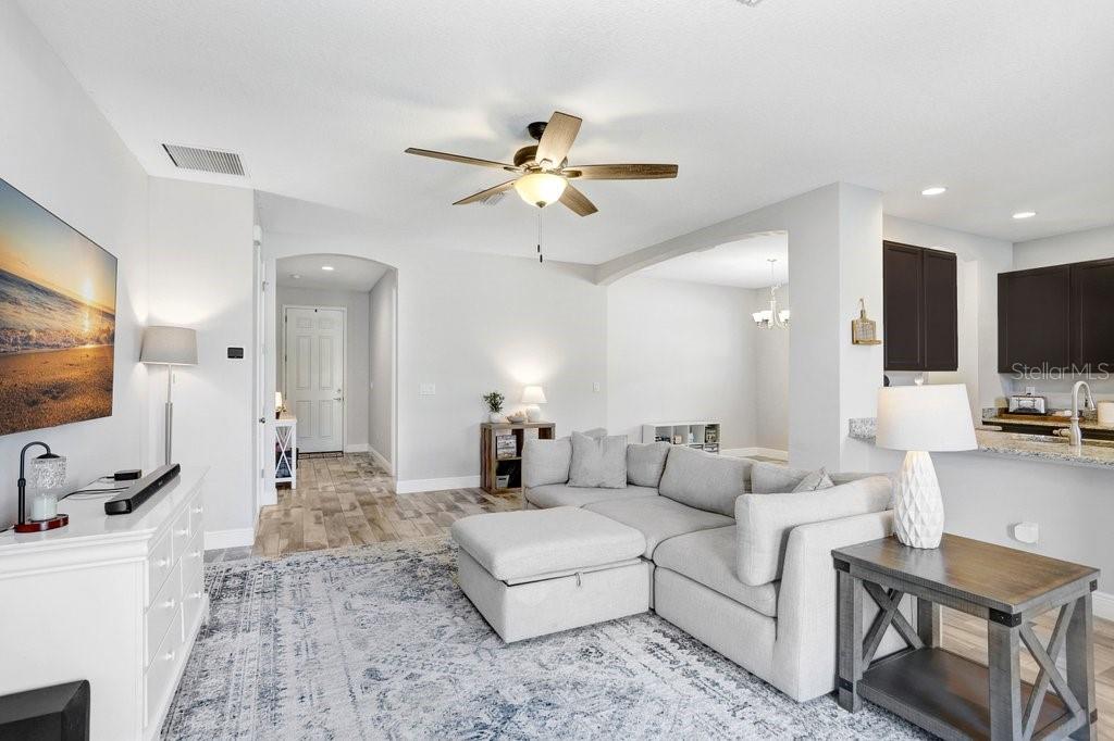 Living room with view to the front door, Kitchen and dining area