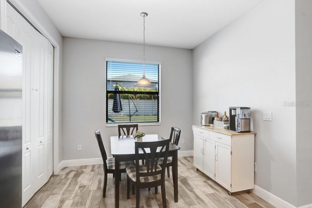 Dinette With view to the backyard, kitchen and living room