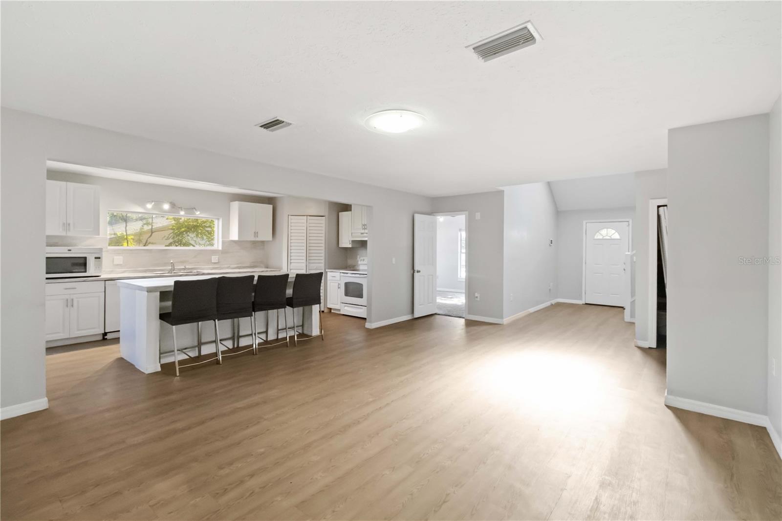 Family room view to kitchen and front door