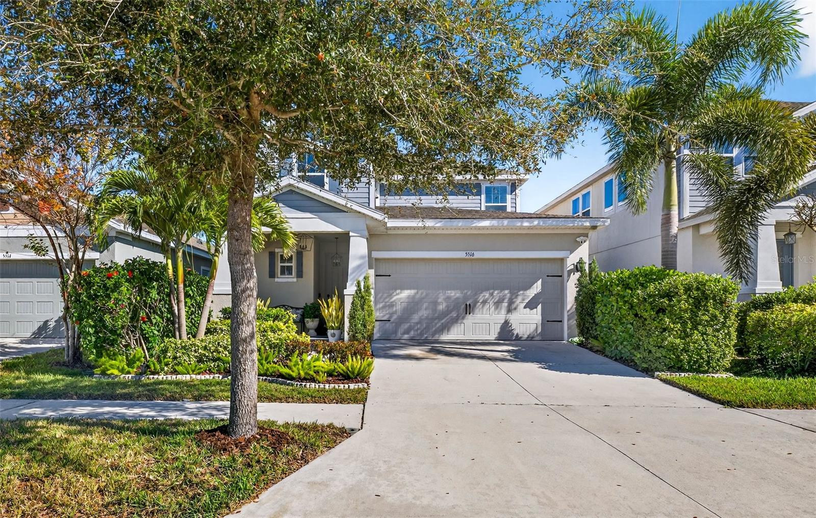 Front of home showing well manicured lawn and nice curb appeal