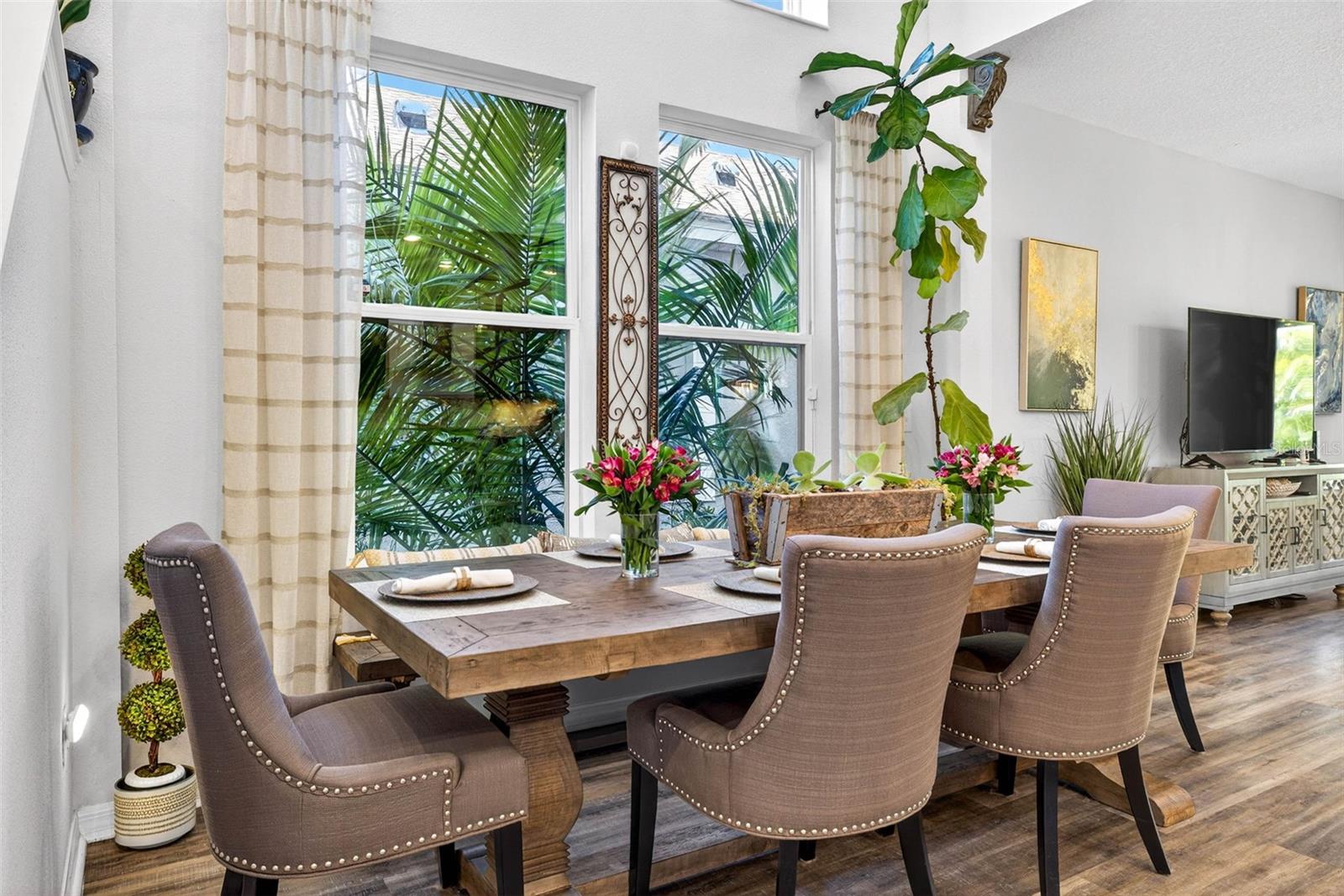 Dining area off of kitchen and main living area with plenty of natural light but still private