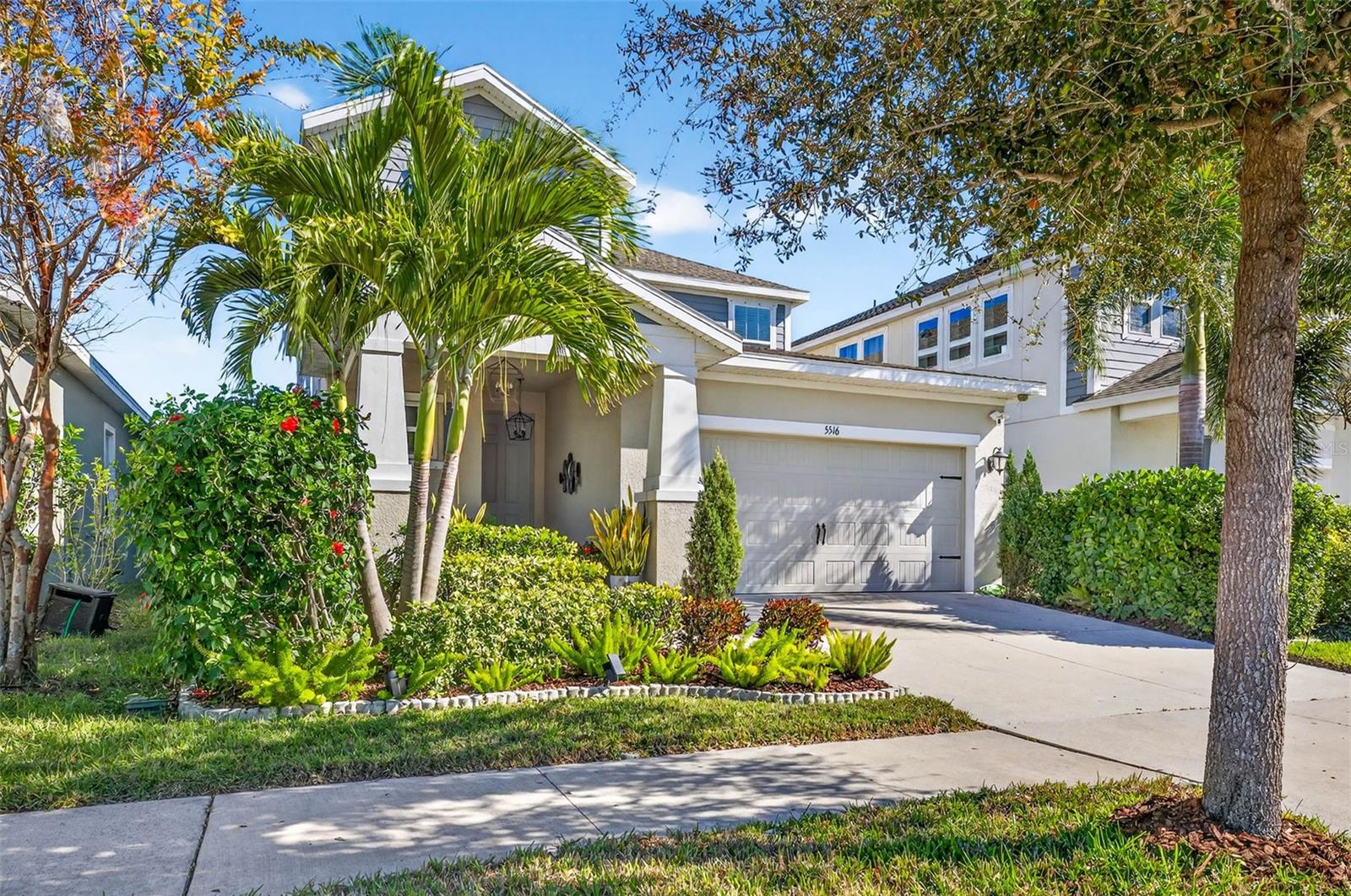 Well manicured front entry with covered front porch