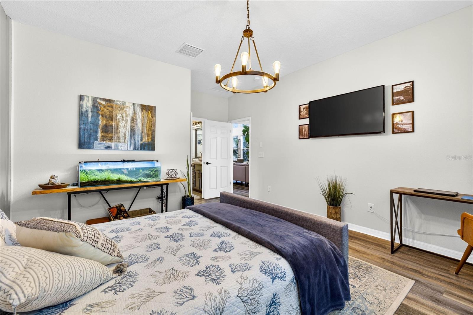 Primary bedroom located downstairs! Also has an en suite bathroom with dual vanity sinks and a walk in shower.