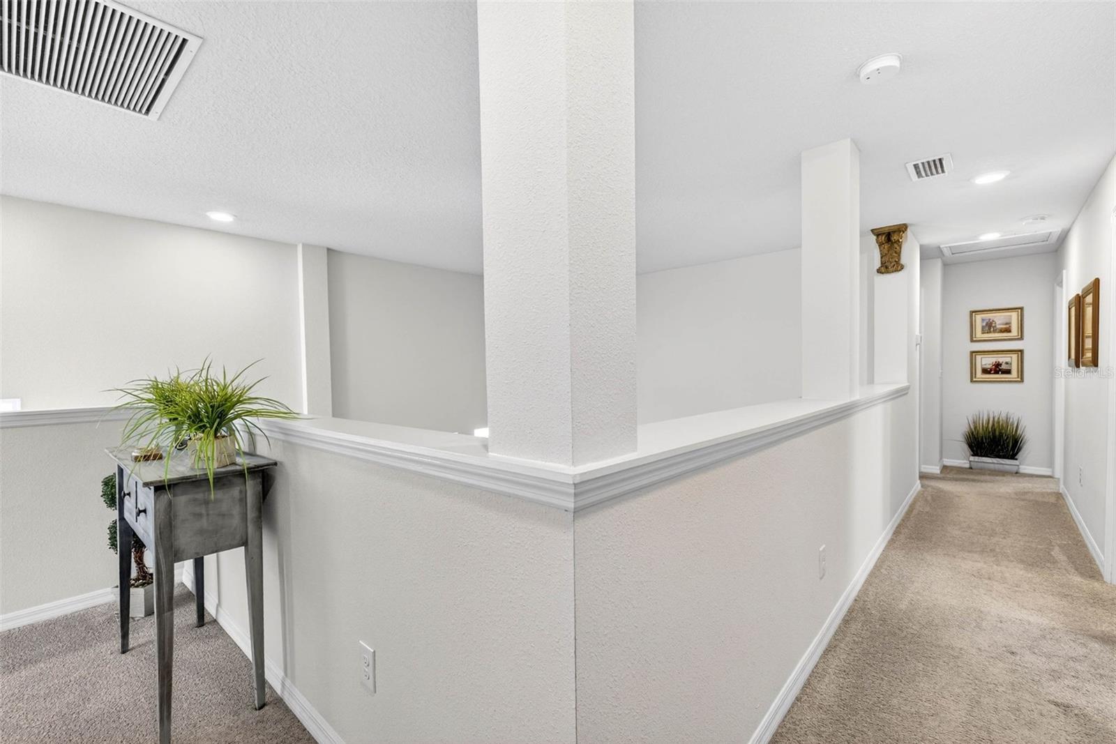 Upstairs hallway where secondary bedrooms and bathrooms are located.