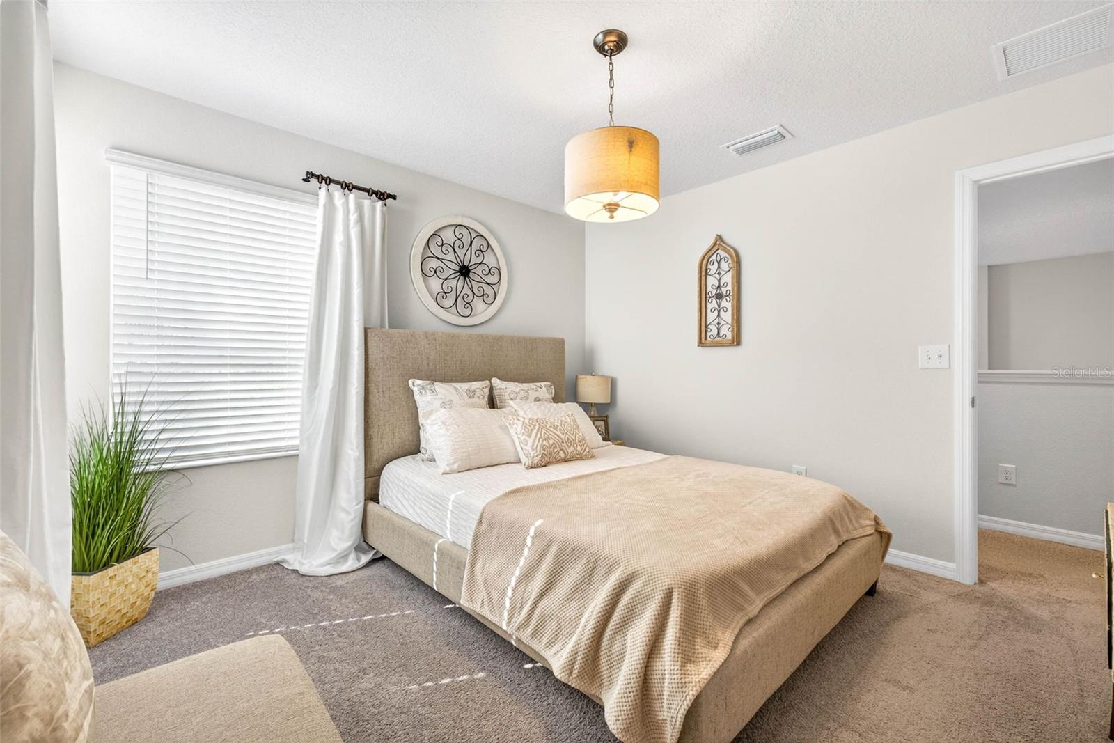 Secondary bedroom with plenty of natural light.