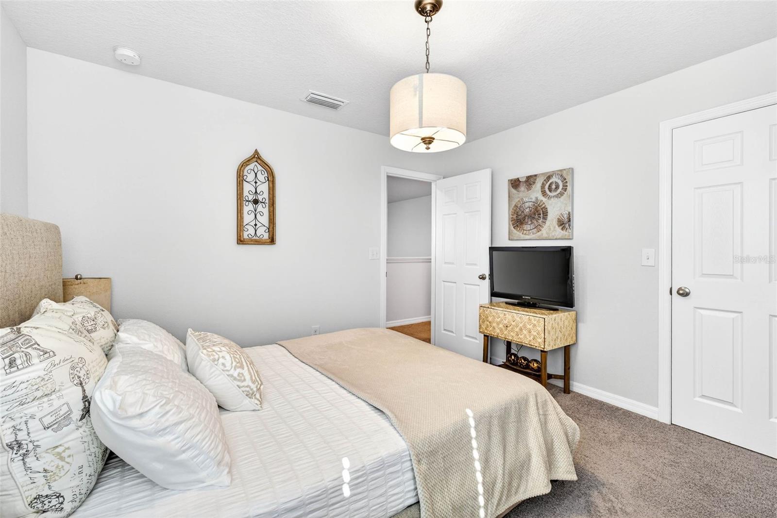 Secondary bedroom with built in closet