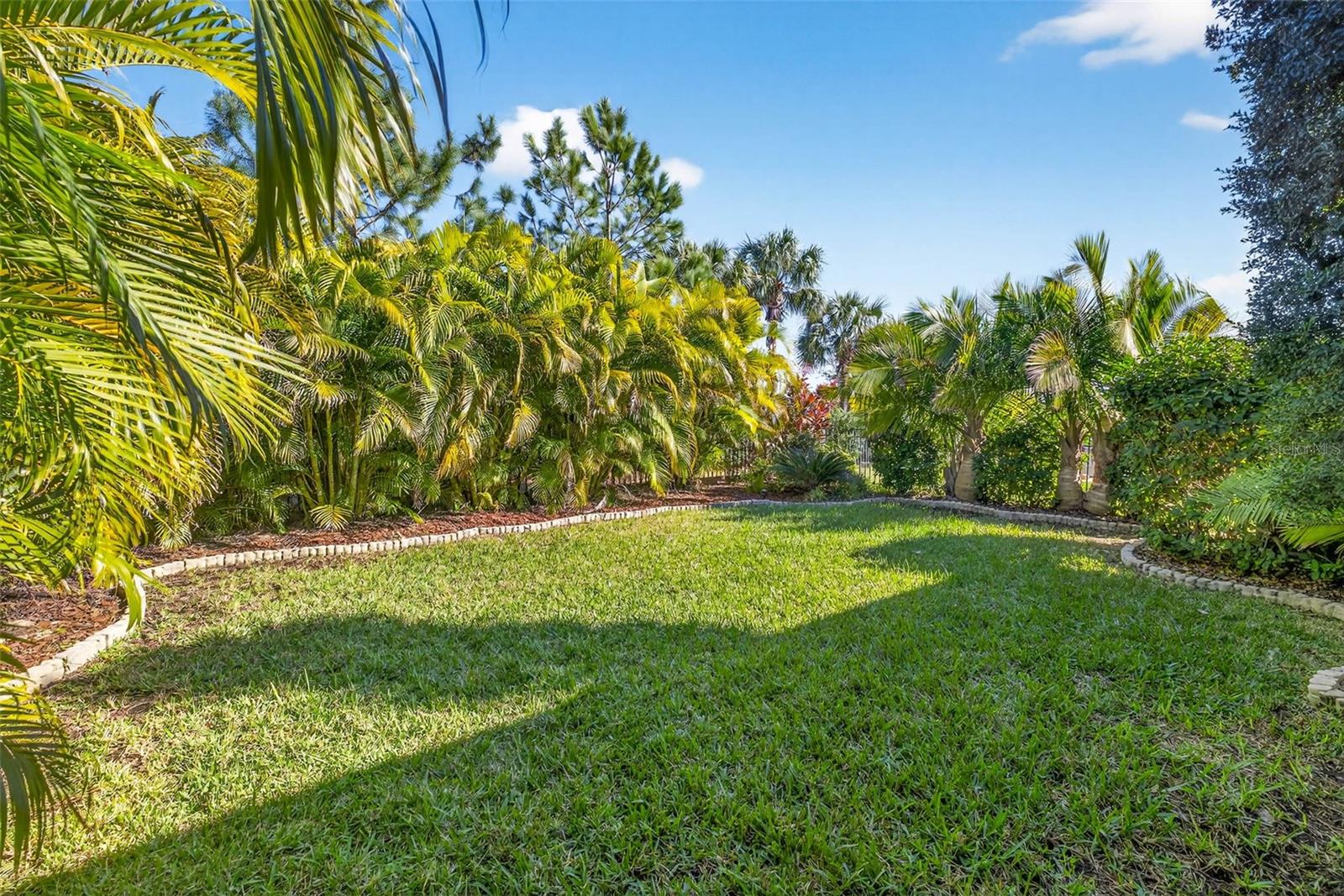 Beautifully landscaped backyard provides plenty of privacy.
