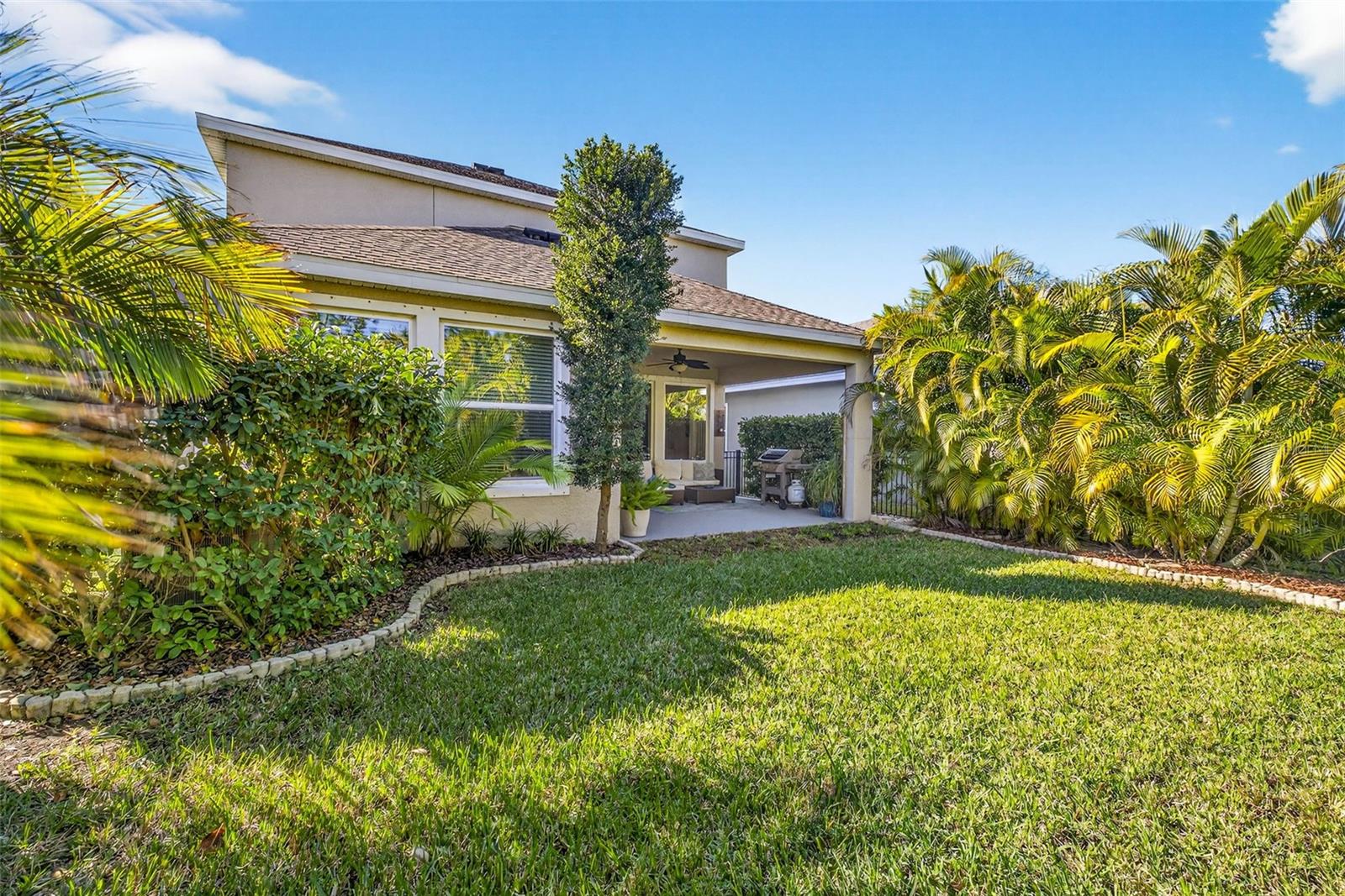 Landscaped backyard with decorative curbing.