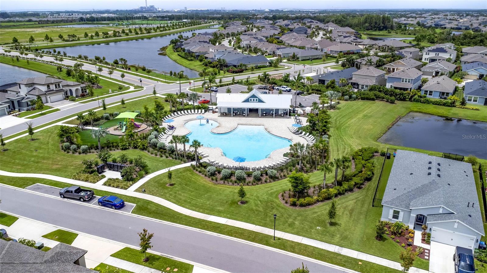 Community amenity with playground, pool and clubhouse.