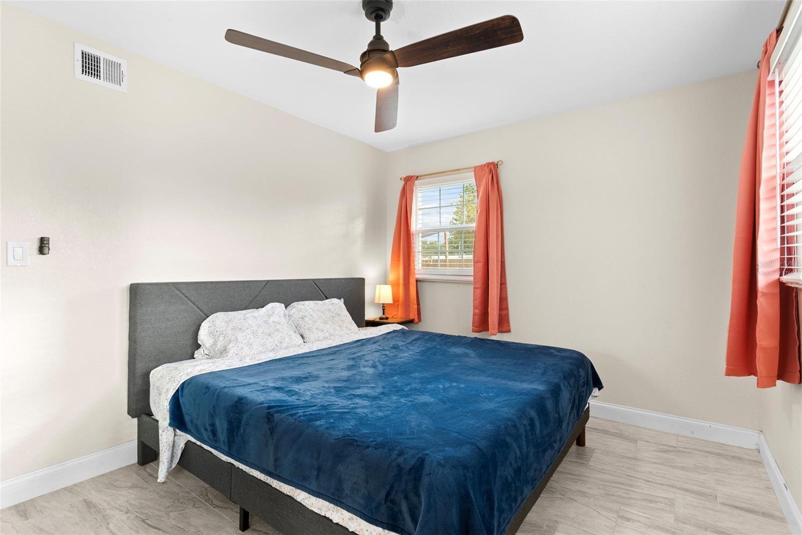 Bedroom 1 with room for king size bed and virtually staged / bed and furnishings not there anymore