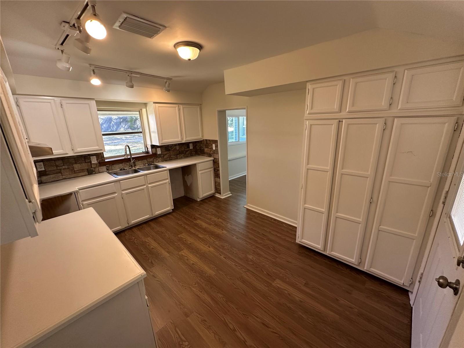 Kitchen with pantry and track lighting
