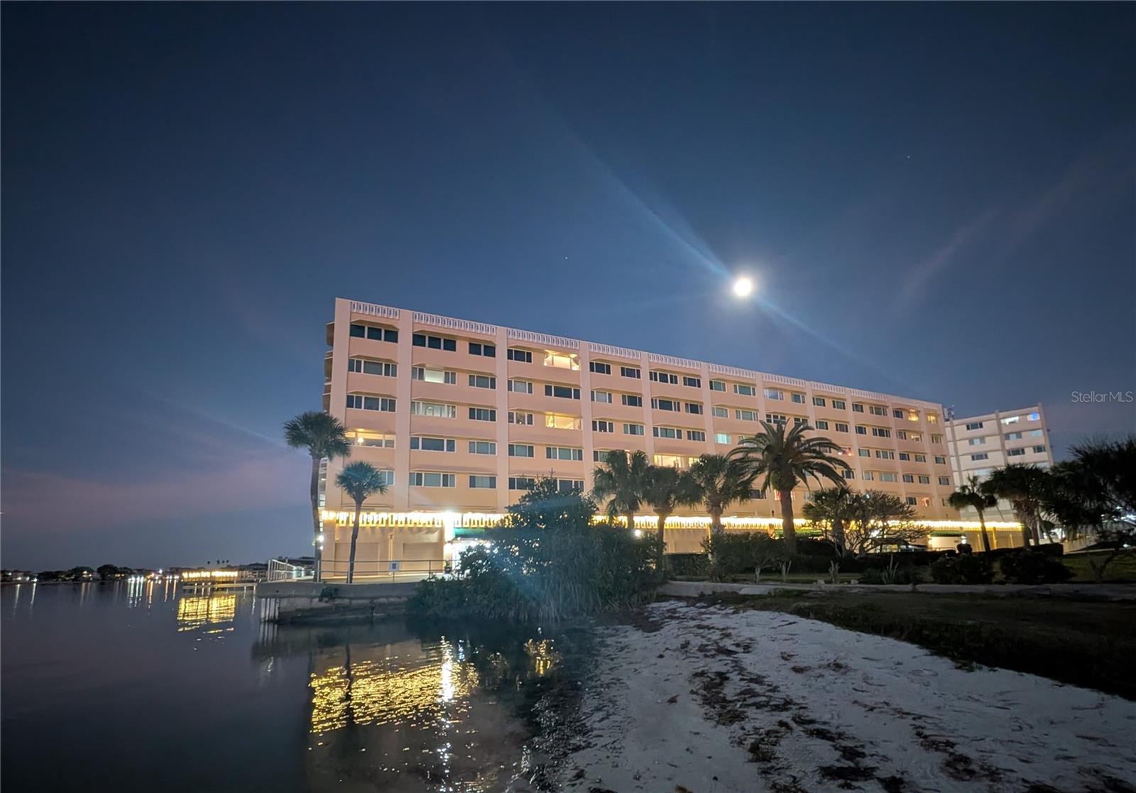 Moon over Harbour Club from the beach.
