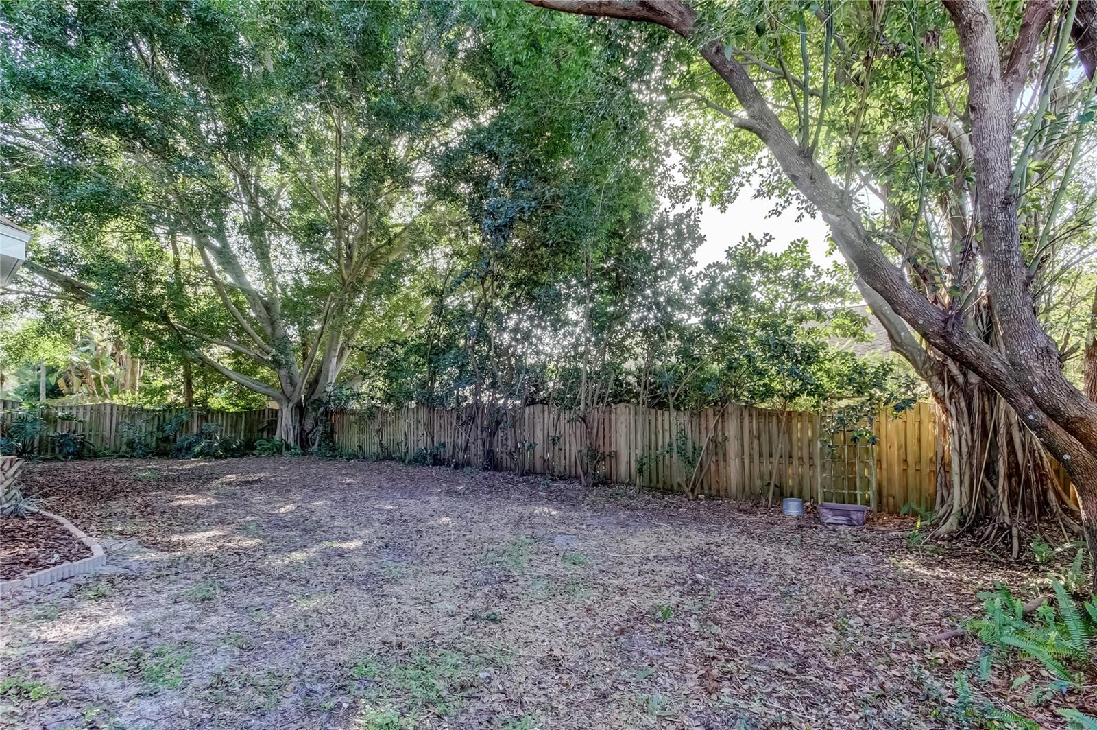 49. FULLY Fenced in Backyard is Private.. Banyan Trees in the Corners are GORGEOUS!