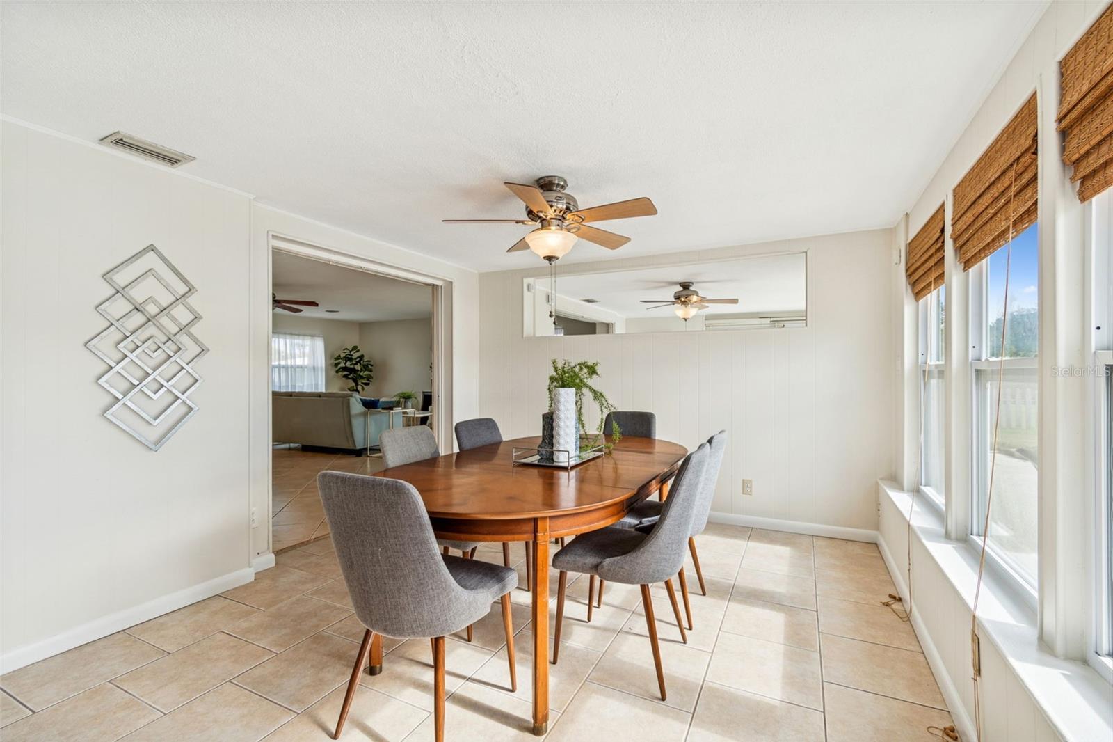 Dining area connects to living area and kitchen- perfect for entertaining all while enjoying pool and lake access