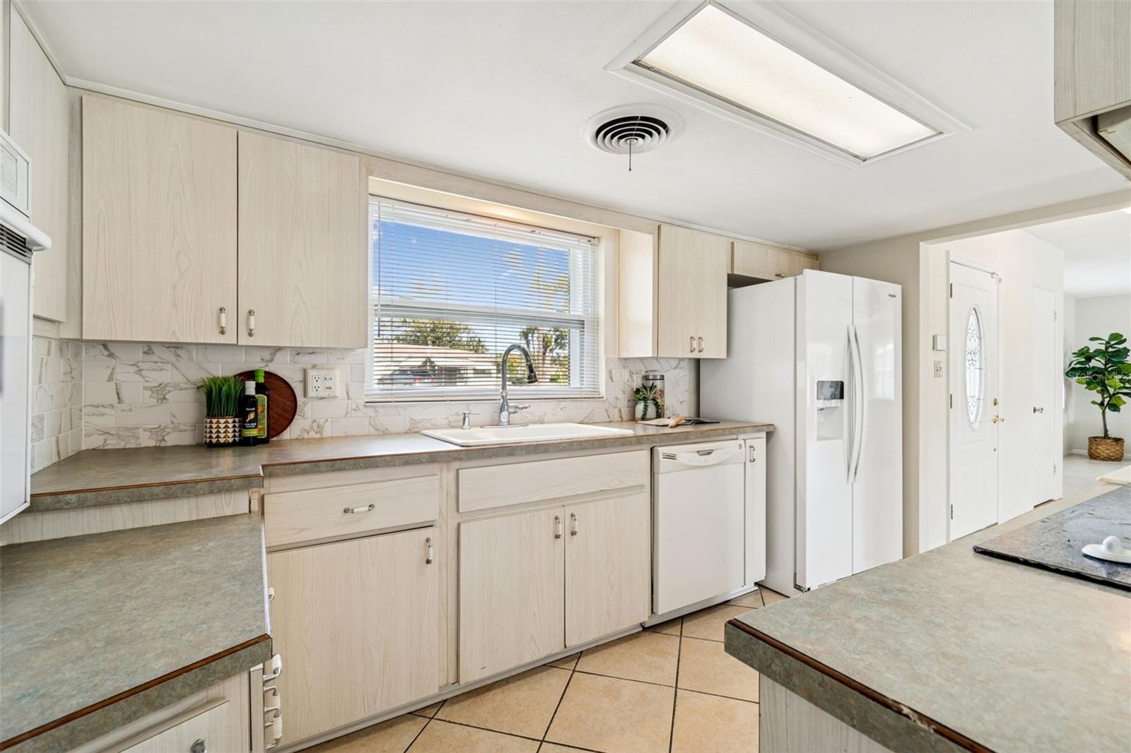Solid countertops and spacious kitchen; so functional